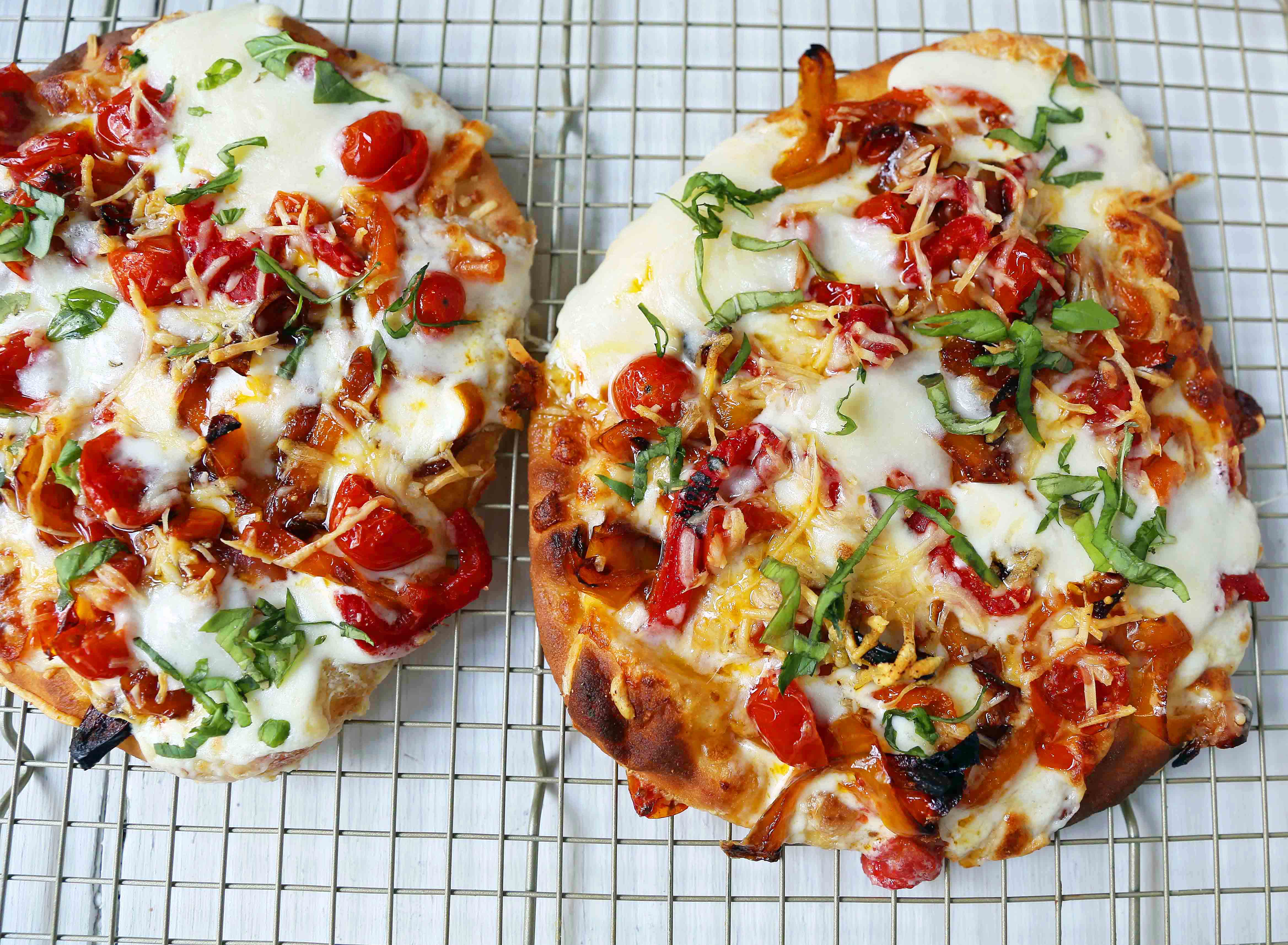 Veggie Pizza Recipe. Homemade veggie pizza with roasted vegetables, mozzarella cheese, and ricotta. Naan Bread Pizza made in 20 minutes! www.modernhoney.com #flatbreadpizza #naanbreadpizza