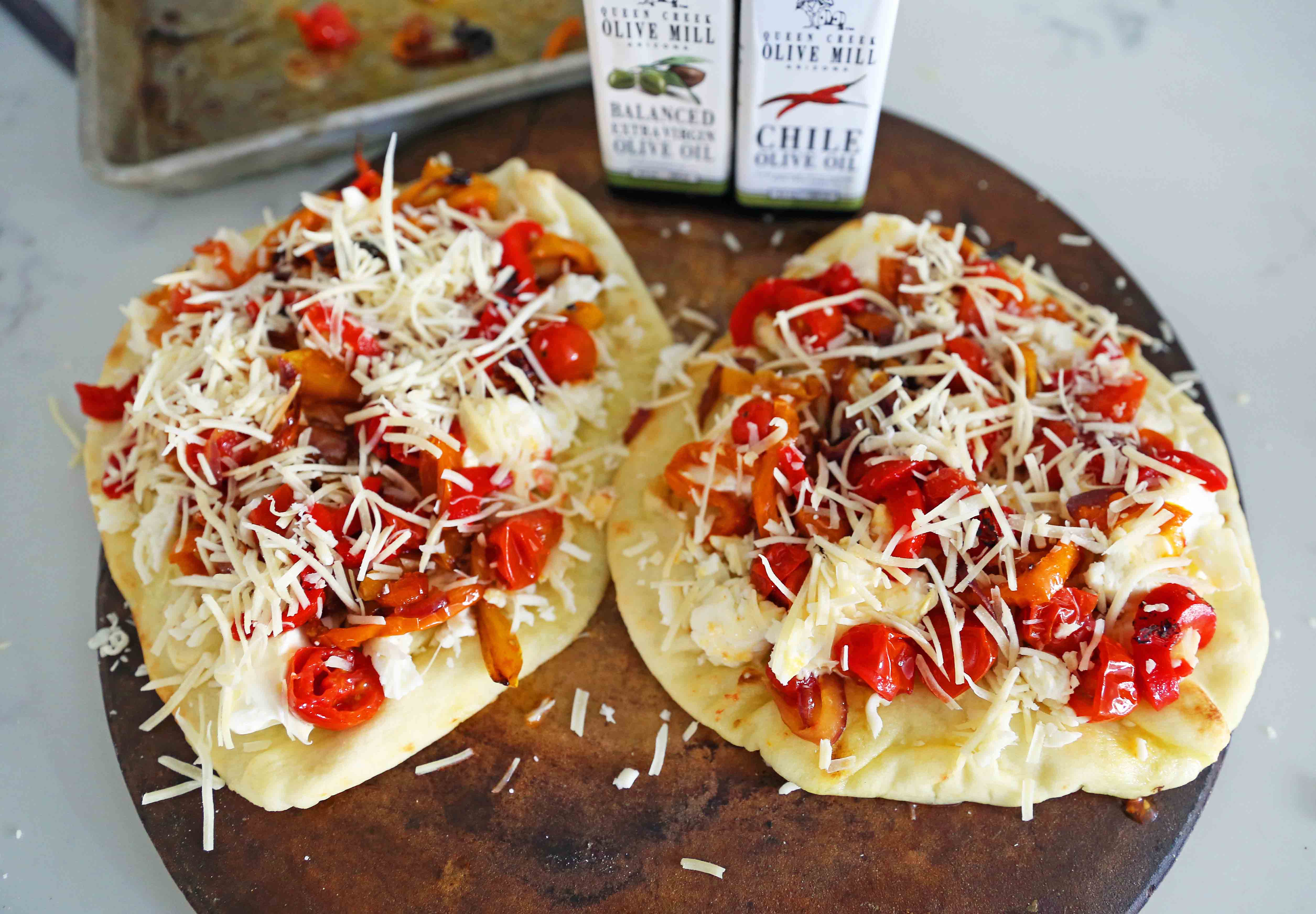 Veggie Pizza Recipe. Homemade veggie pizza with roasted vegetables, mozzarella cheese, and ricotta. Naan Bread Pizza made in 20 minutes! www.modernhoney.com #flatbreadpizza #naanbreadpizza