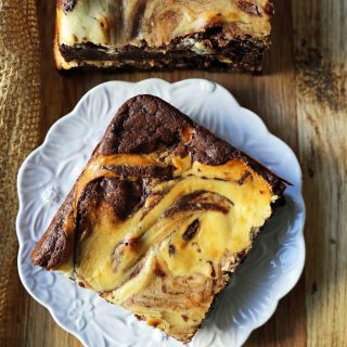 Cheesecake Brownies Homemade double chocolate chunk brownies with a sweet and tangy cheesecake swirl. Cheesecake and a Brownie in one dessert bar! Cream Cheese Brownies Recipe. www.modernhoney.com #creamcheesebrownies #cheesecakebrownies #brownies #cheesecakebrownierecipe #homemadebrownies