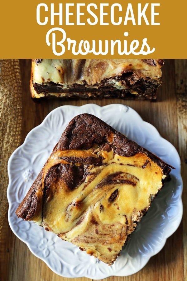 Cheesecake Brownies Homemade double chocolate chunk brownies with a sweet and tangy cheesecake swirl. Cheesecake and a Brownie in one dessert bar! Cream Cheese Brownies Recipe. www.modernhoney.com #creamcheesebrownies #cheesecakebrownies #brownies #cheesecakebrownierecipe #homemadebrownies