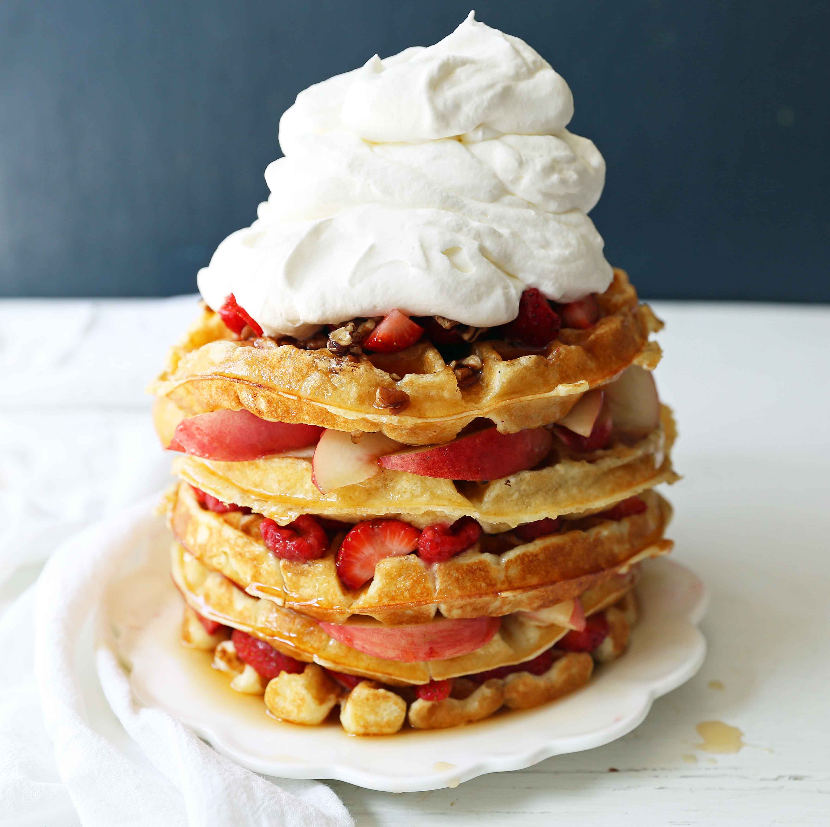 One Bowl Easy Buttermilk Waffles. Quick waffle recipe which creates chewy, crispy, and buttery waffles. The perfect waffle recipe. www.modernhoney.com #waffles #wafflerecipe #buttermilkwaffles #buttermilkwaffle 