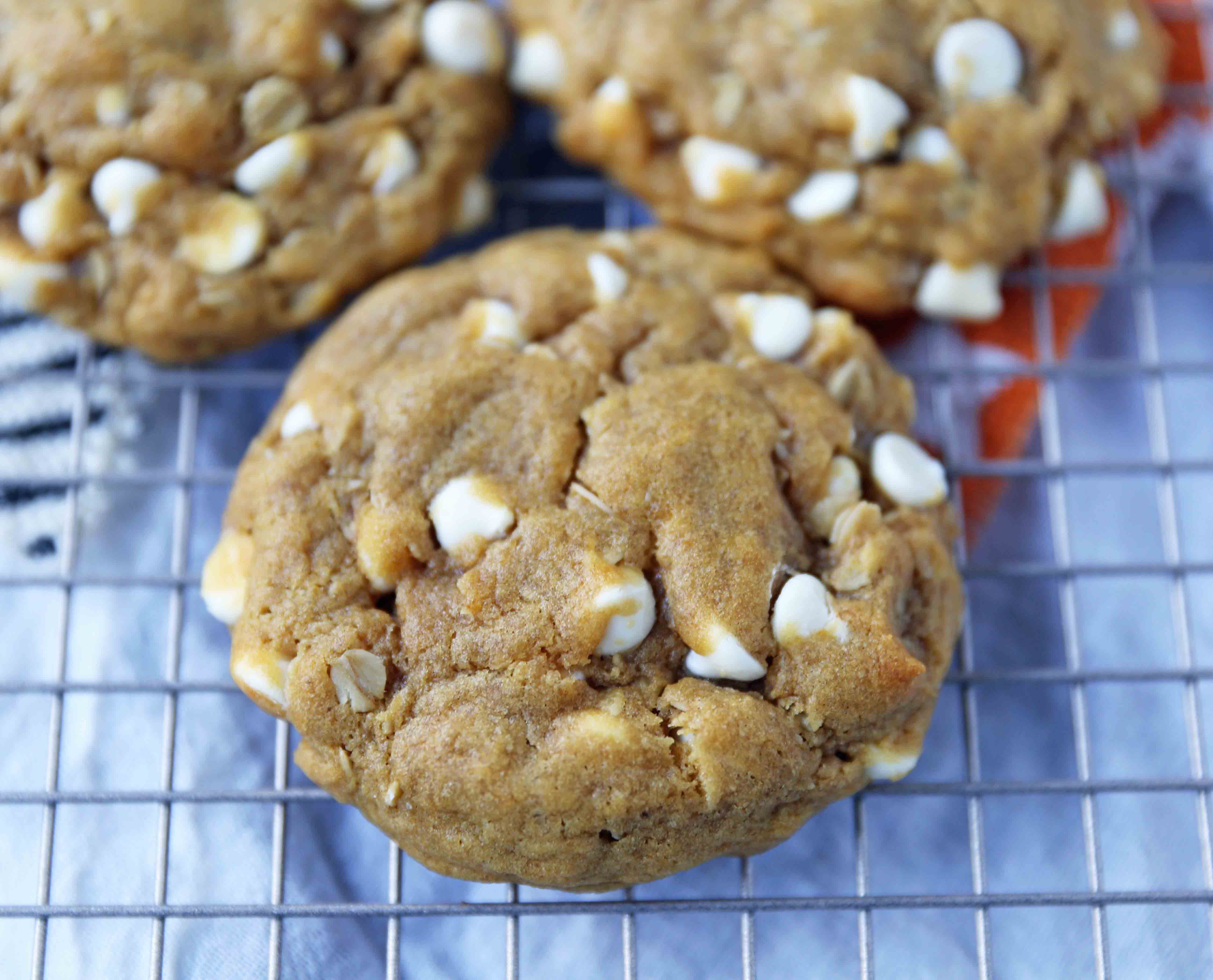 Pumpkin White Chocolate Chip Cookies Recipe. Soft and Chewy Pumpkin Oatmeal Cookies with White Chocolate Chips. The best chewy pumpkin cookies. www.modernhoney.com #pumpkincookies #pumpkinoatmealcookies #pumpkinwhitechocolatechipcookies #fallrecipes 