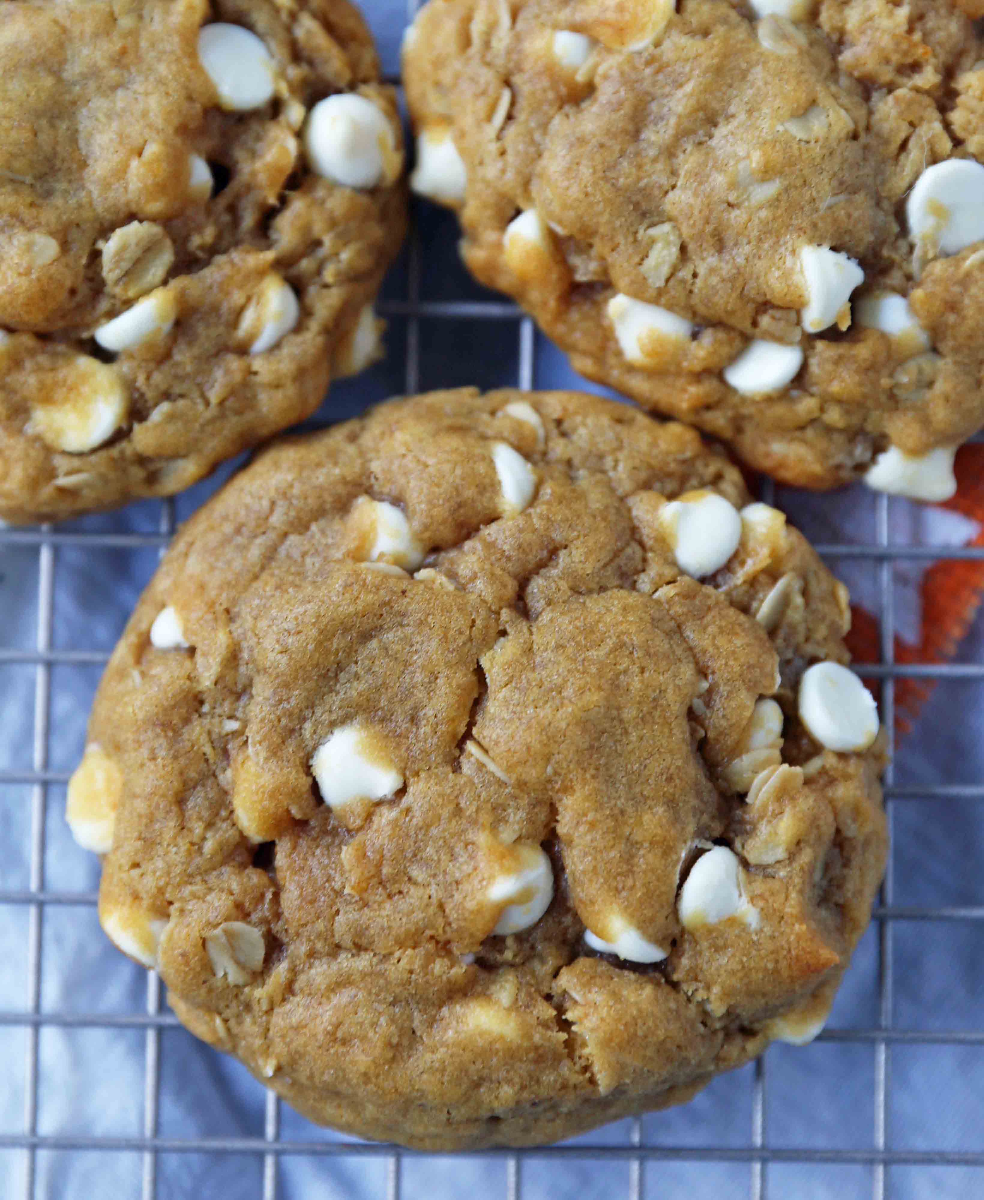 Pumpkin White Chocolate Chip Cookies Recipe. Soft and Chewy Pumpkin Oatmeal Cookies with White Chocolate Chips. The best chewy pumpkin cookies. www.modernhoney.com #pumpkincookies #pumpkinoatmealcookies #pumpkinwhitechocolatechipcookies #fallrecipes 