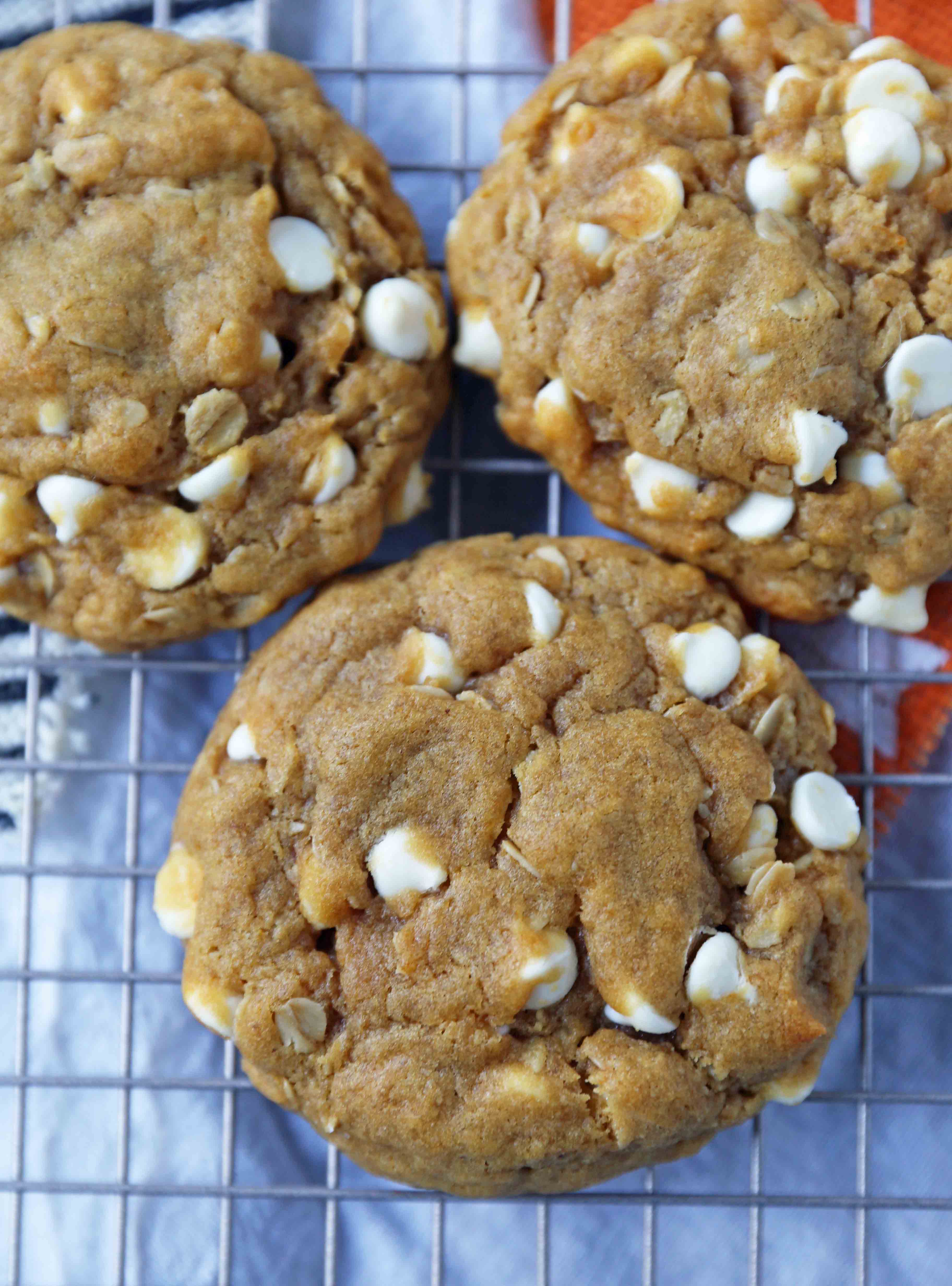 Pumpkin White Chocolate Chip Cookies Recipe. Soft and Chewy Pumpkin Oatmeal Cookies with White Chocolate Chips. The best chewy pumpkin cookies. www.modernhoney.com #pumpkincookies #pumpkinoatmealcookies #pumpkinwhitechocolatechipcookies #fallrecipes 