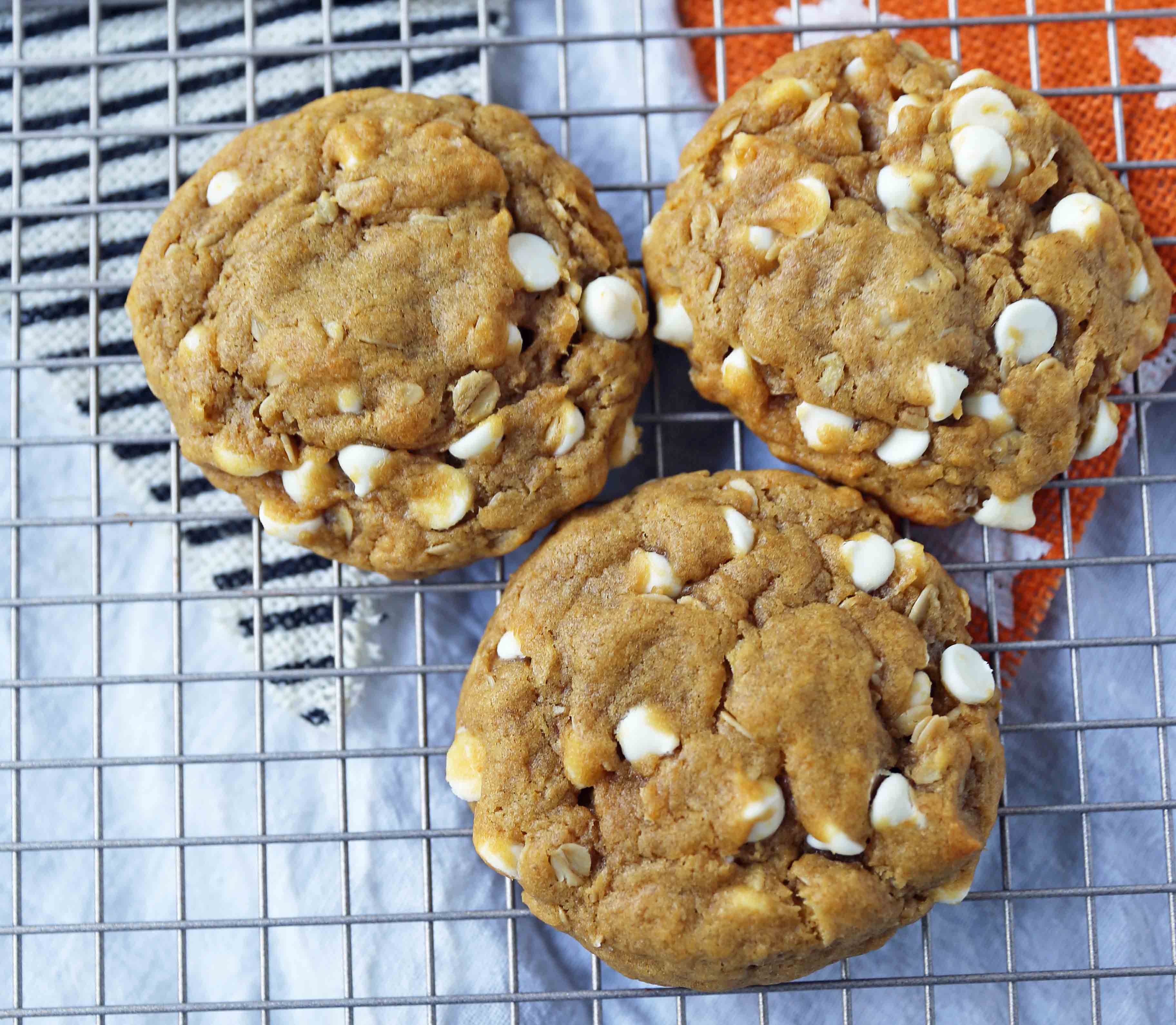 Pumpkin White Chocolate Chip Cookies Recipe. Soft and Chewy Pumpkin Oatmeal Cookies with White Chocolate Chips. The best chewy pumpkin cookies. www.modernhoney.com #pumpkincookies #pumpkinoatmealcookies #pumpkinwhitechocolatechipcookies #fallrecipes 