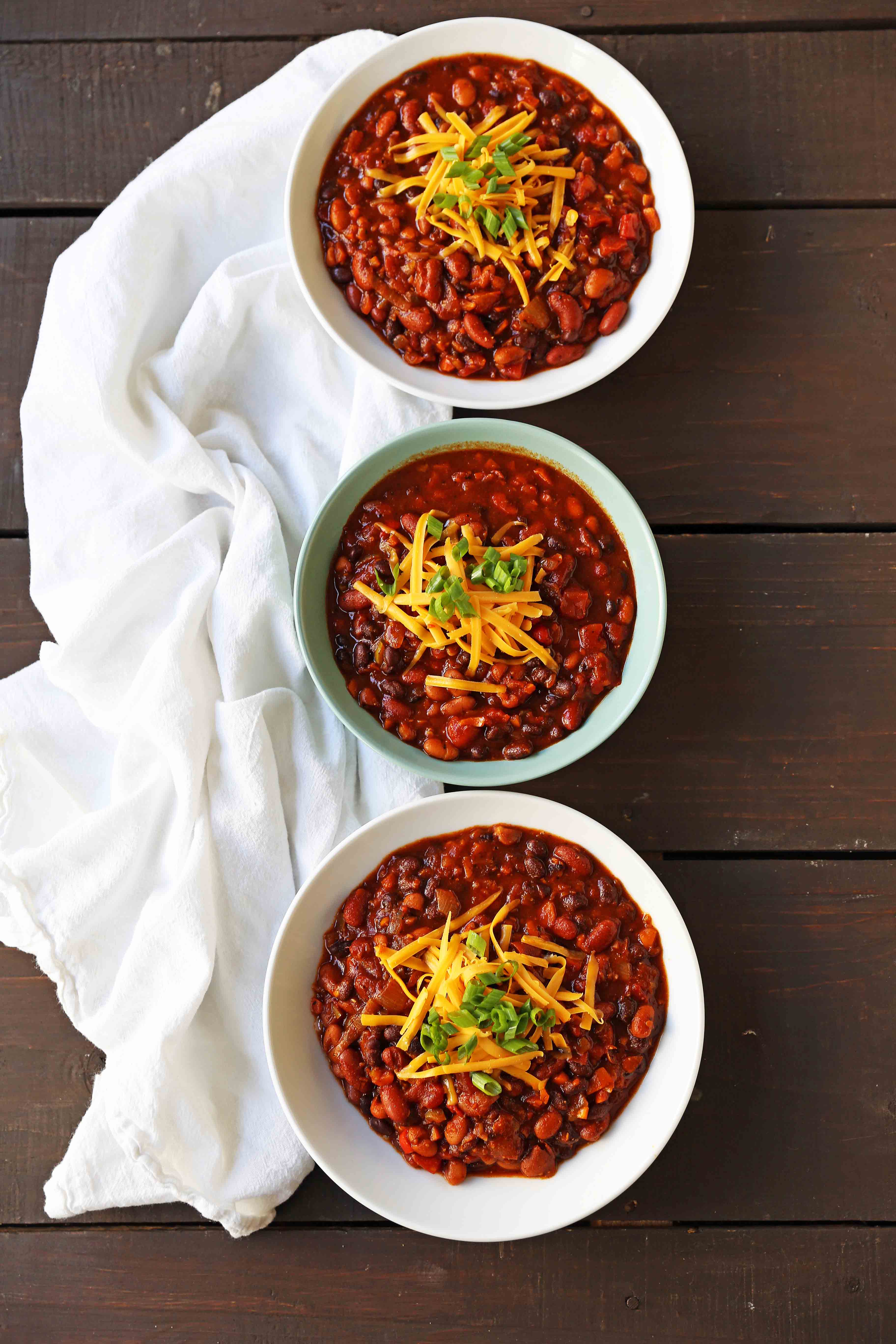 Veggie Chili Recipe. A healthy vegetable and bean filled chili in a spicy tomato sauce. The perfect Veggie Chili recipe and you won't even miss the meat! www.modernhoney.com #veggiechili #veggiechilirecipe #vegetarian #chili