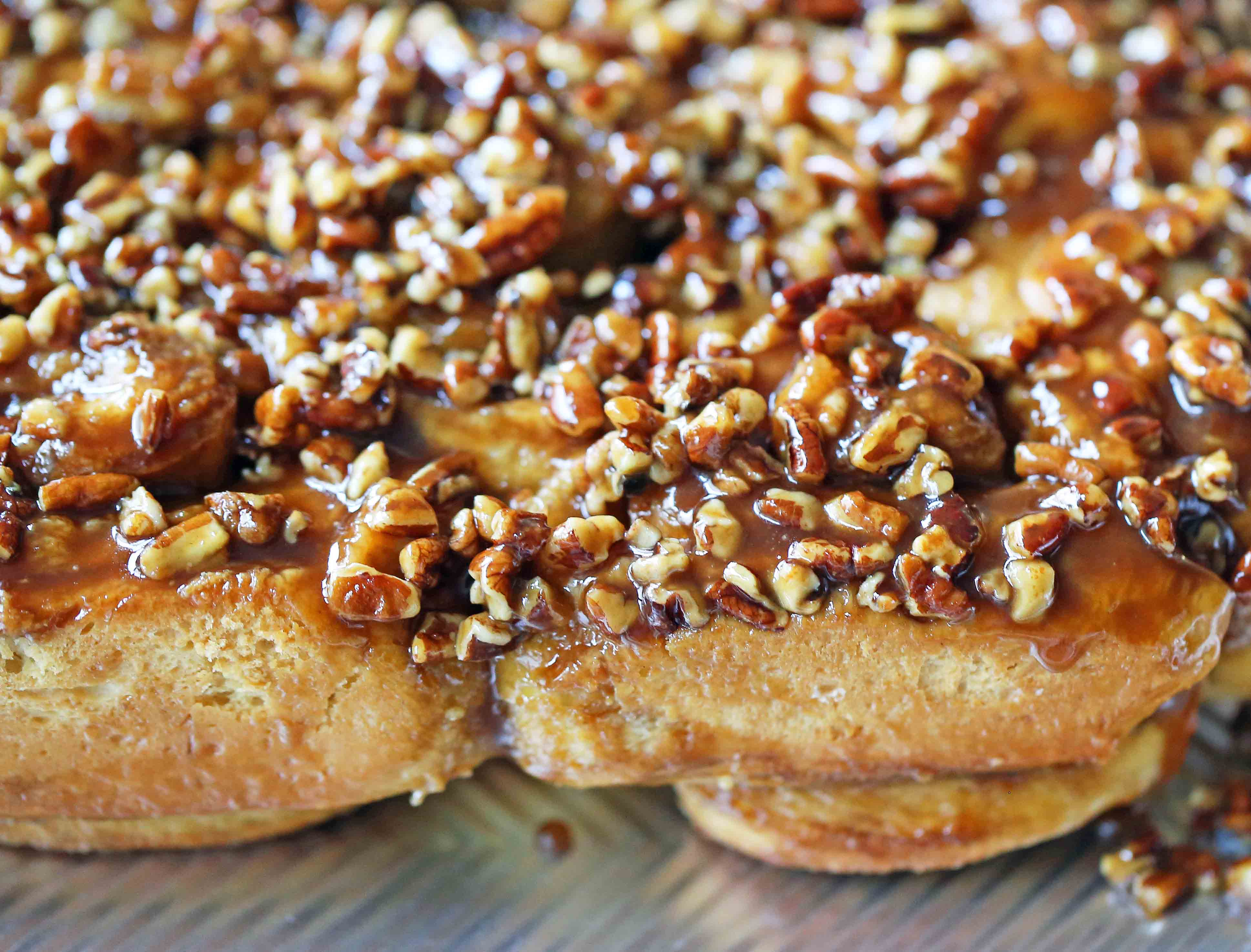 Caramel Pecan Rolls Homemade sweet rolls with rich caramel sauce and pecans. The perfect pecan sticky buns recipe! How to make homemade sticky buns from scratch. www.modernhoney.com #stickybuns #pecanrolls #caramelpecanrolls #caramelrolls #caramelstickybuns #pecanbuns
