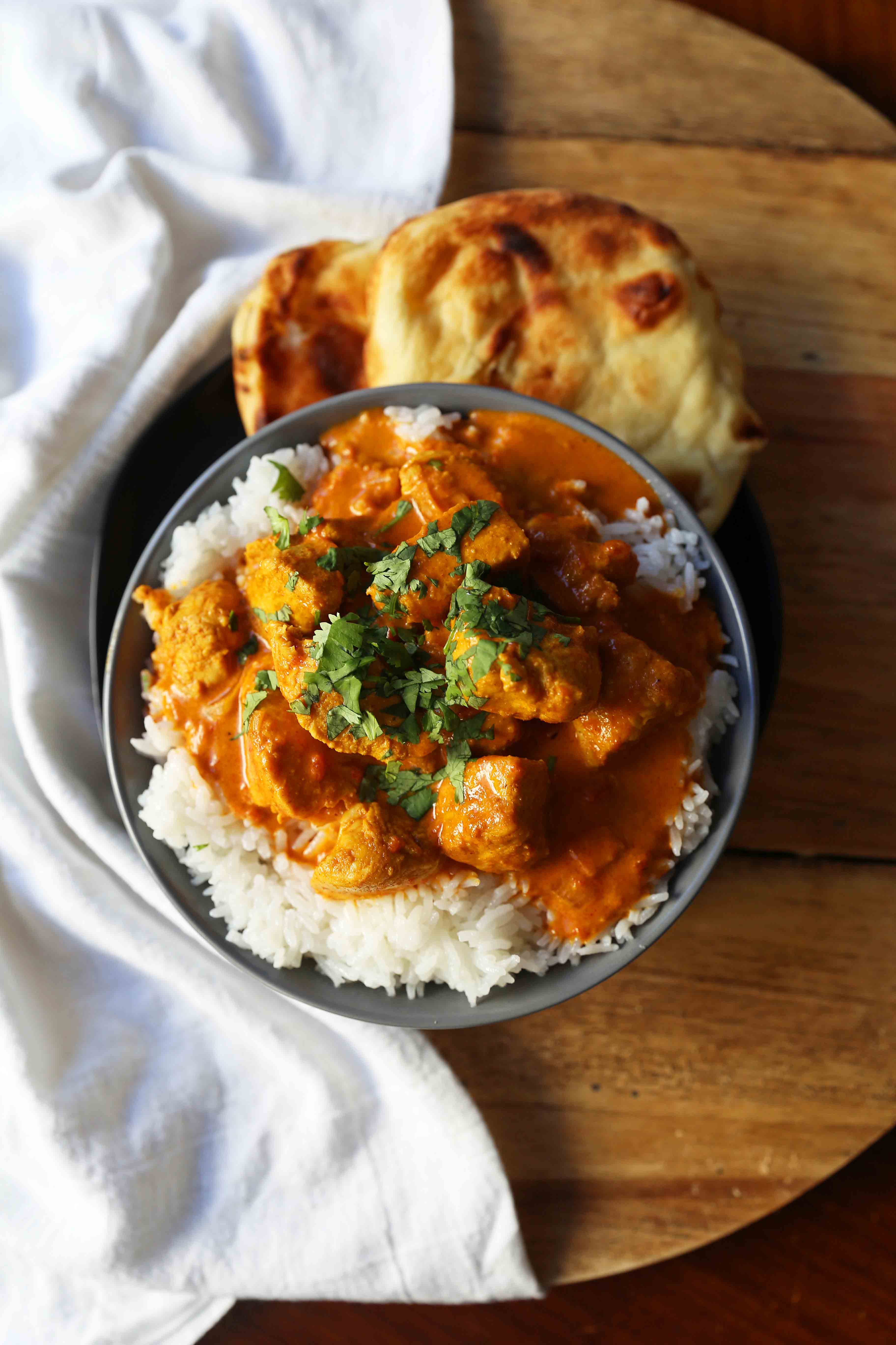 Chicken Tikka Masala A popular Indian dish with a spiced tomato cream based sauce with tender chicken and spices. Authentic Tikki Masala with Chicken Recipe. www.modernhoney.com #tikkamasala #chickentikkamasala #indianfood #indiancurry #indianchickencurry #comfortfood