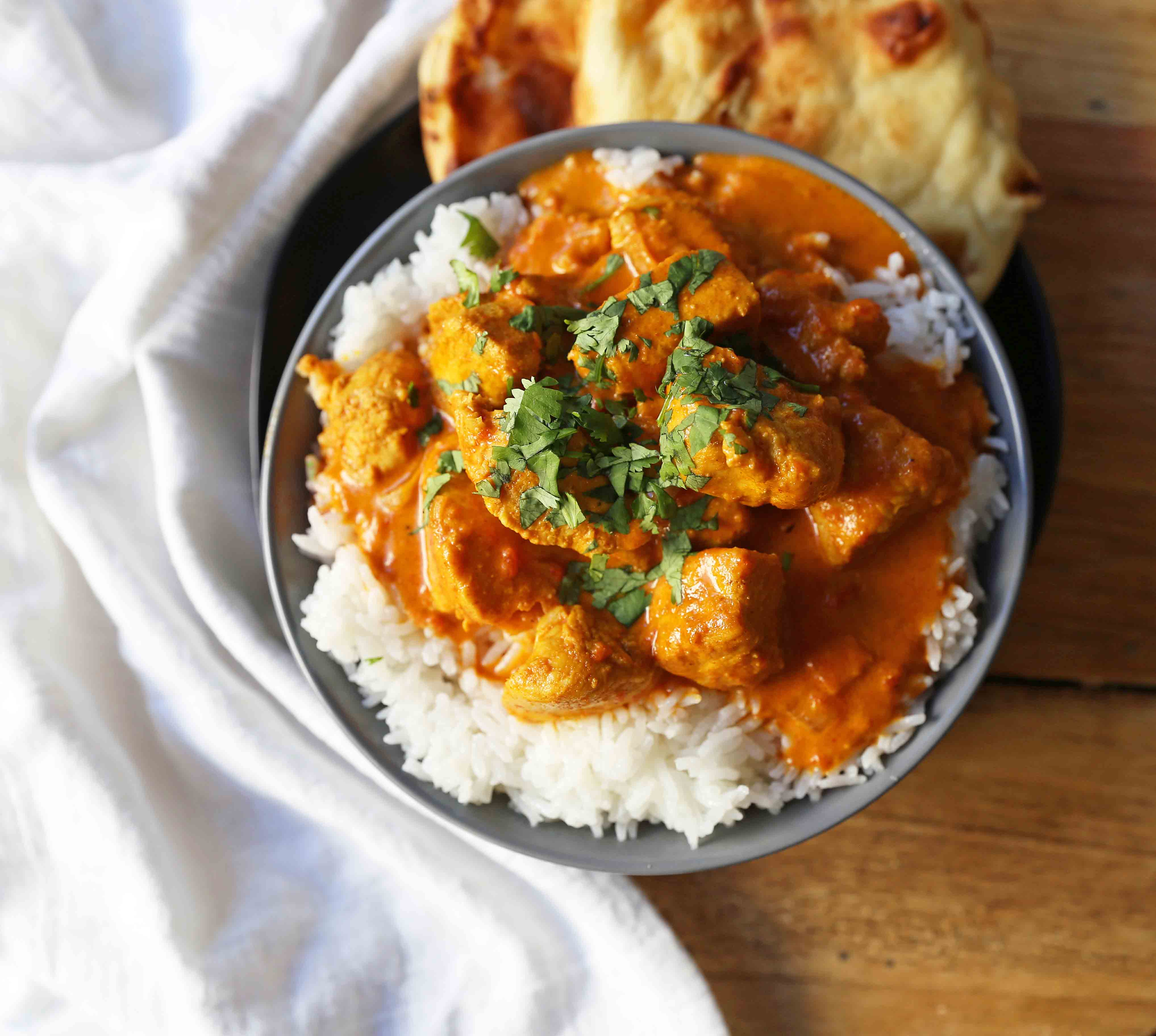 Chicken Tikka Masala A popular Indian dish with a spiced tomato cream based sauce with tender chicken and spices. Authentic Tikki Masala with Chicken Recipe. www.modernhoney.com #tikkamasala #chickentikkamasala #indianfood #indiancurry #indianchickencurry #comfortfood