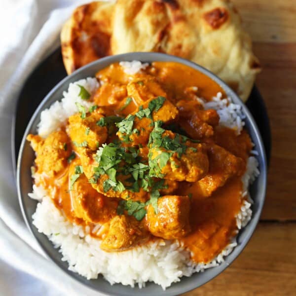 Chicken Tikka Masala A popular Indian dish with a spiced tomato cream based sauce with tender chicken and spices. Authentic Tikki Masala with Chicken Recipe. www.modernhoney.com #tikkamasala #chickentikkamasala #indianfood #indiancurry #indianchickencurry #comfortfood