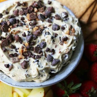 Chocolate Chip Cookie Dough Dip. A sweet cream cheese dip with chocolate chips and chocolate covered toffee bits. Perfect for parties and potlucks and always a crowd favorite! www.modernhoney.com #cookiedoughdip #chocolatechipdip #creamcheesedip #cookiedoughdip #chocolatechipcreamcheesedip #sweetappetizers
