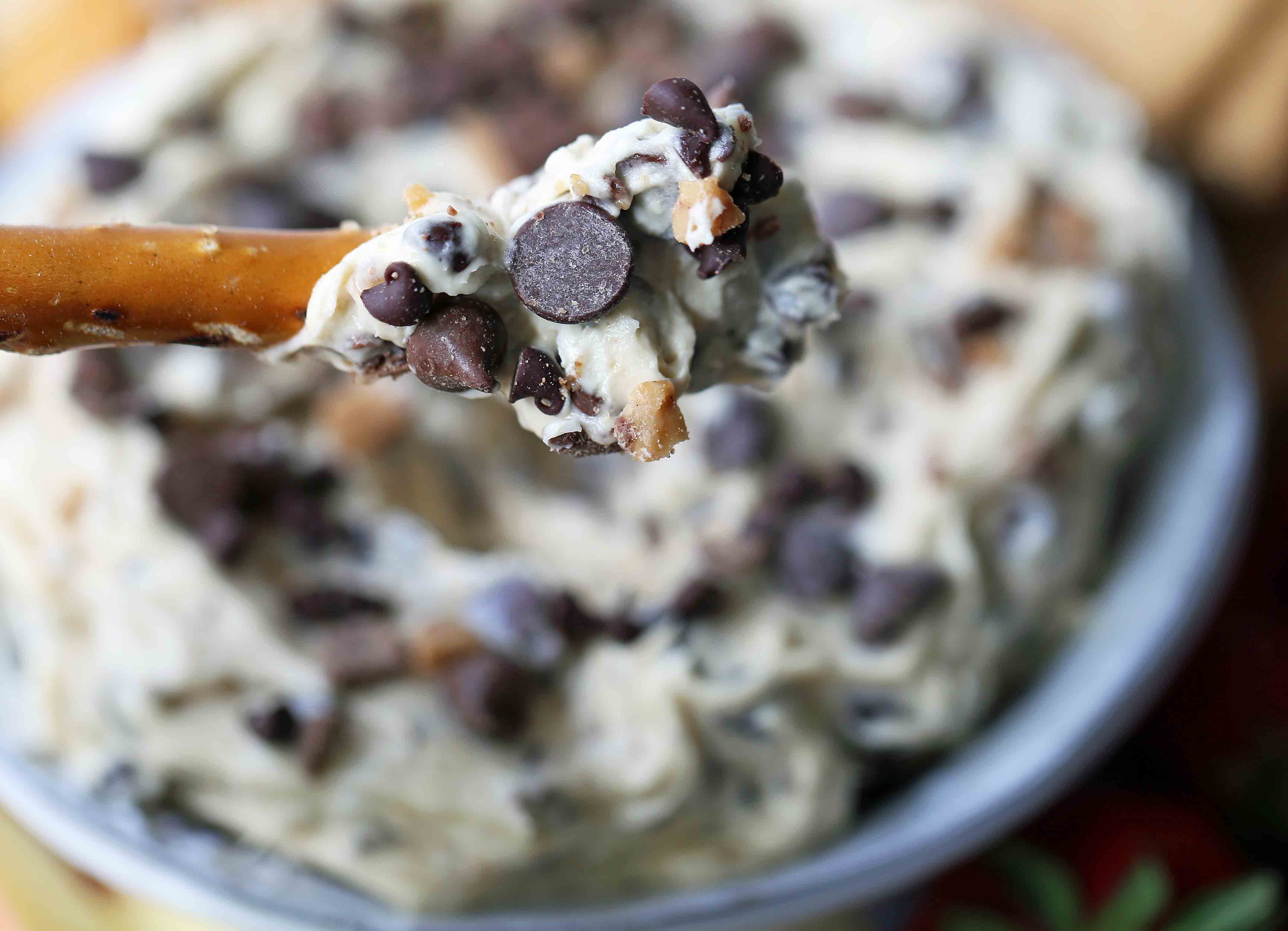 Chocolate Chip Cookie Dough Dip. A sweet cream cheese dip with chocolate chips and chocolate covered toffee bits. Perfect for parties and potlucks and always a crowd favorite! www.modernhoney.com #cookiedoughdip #chocolatechipdip #creamcheesedip #cookiedoughdip #chocolatechipcreamcheesedip #sweetappetizers