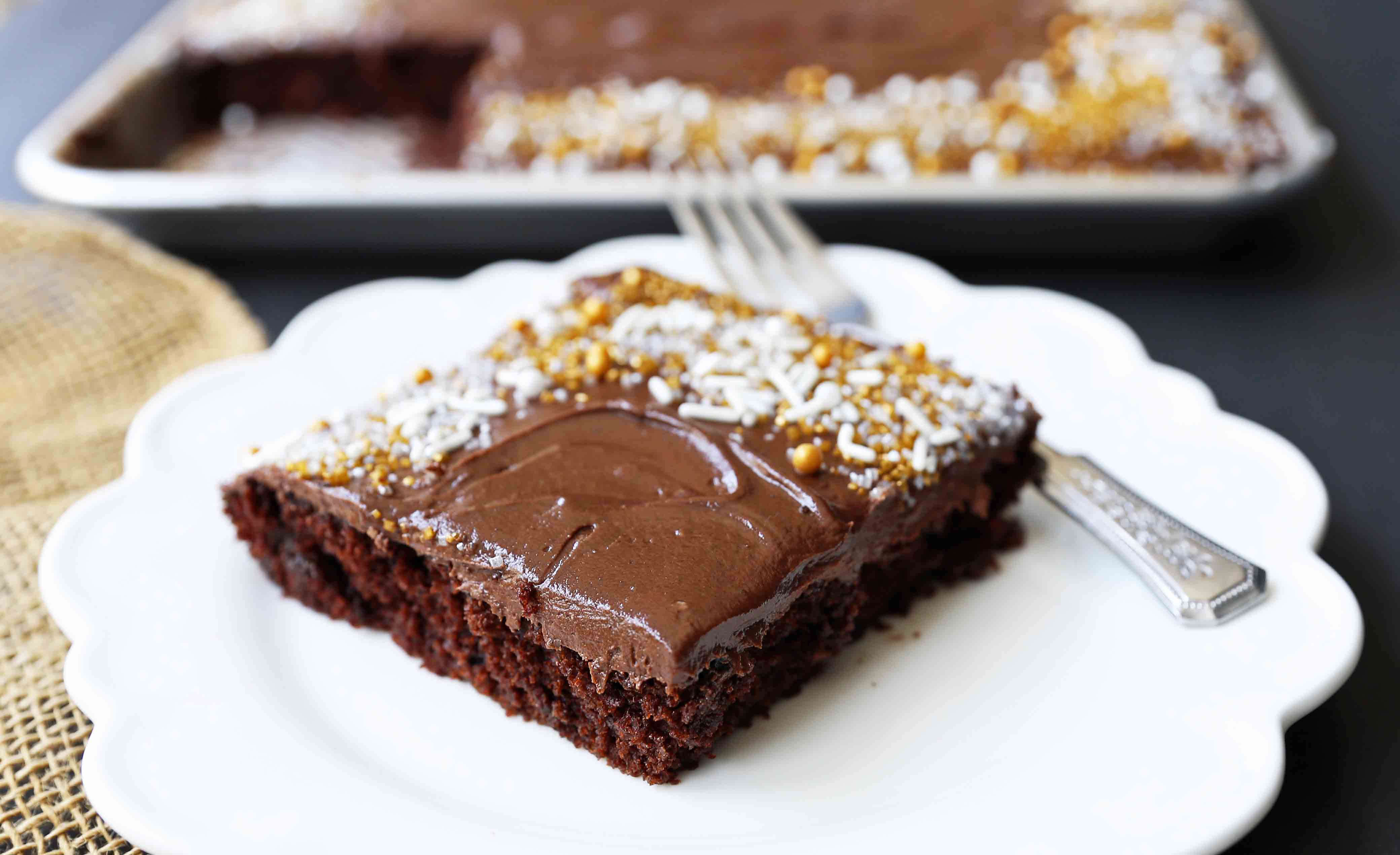 The Best Chocolate SHEET Cake with Milk Chocolate Frosting. Quick and easy homemade chocolate sheet cake recipe. www.modernhoney.com #chocolatesheetcake #sheetcake #chocolatesheetcakerecipe 