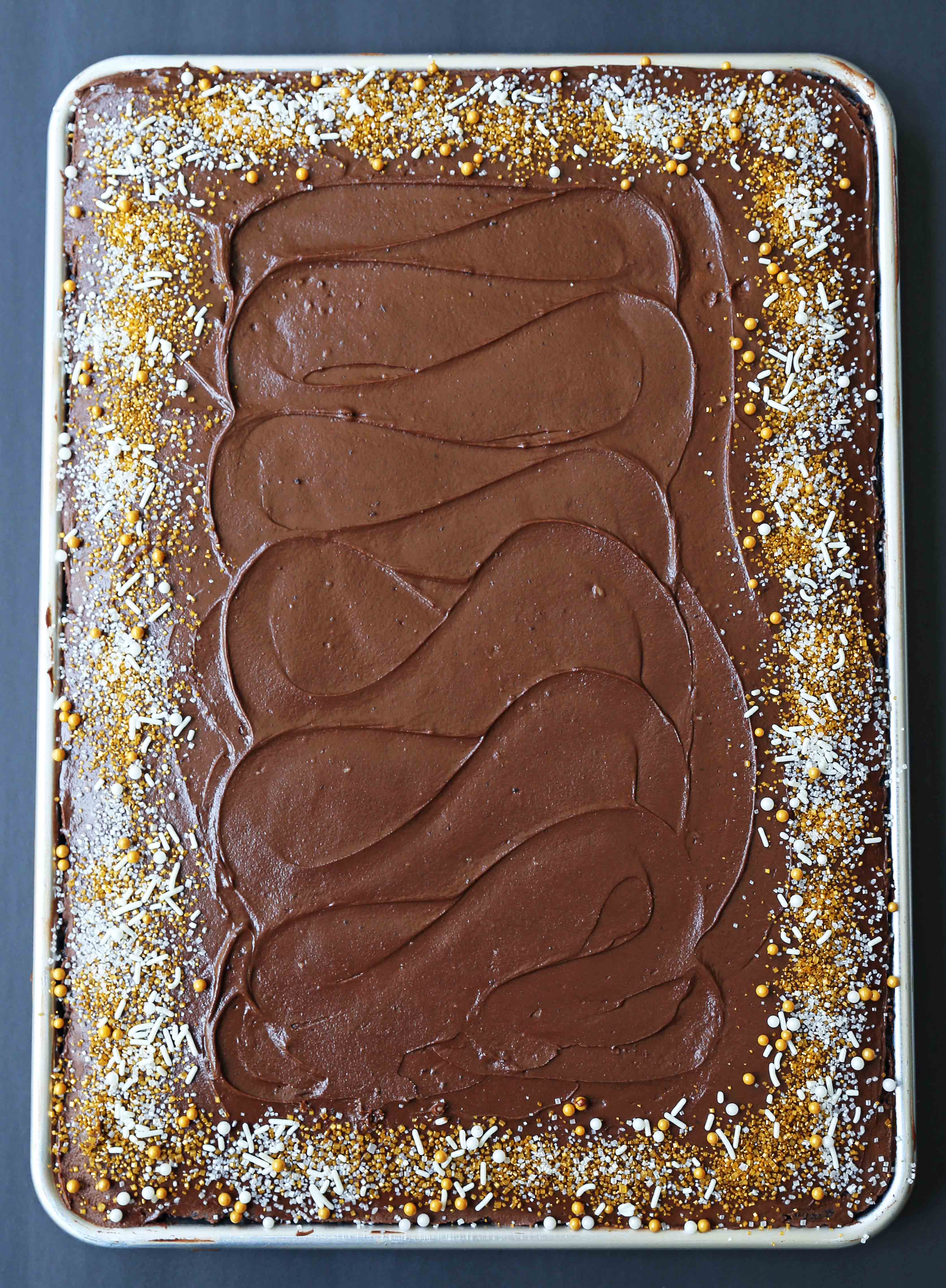 The Best Chocolate SHEET Cake with Milk Chocolate Frosting. Quick and easy homemade chocolate sheet cake recipe. www.modernhoney.com #chocolatesheetcake #sheetcake #chocolatesheetcakerecipe 