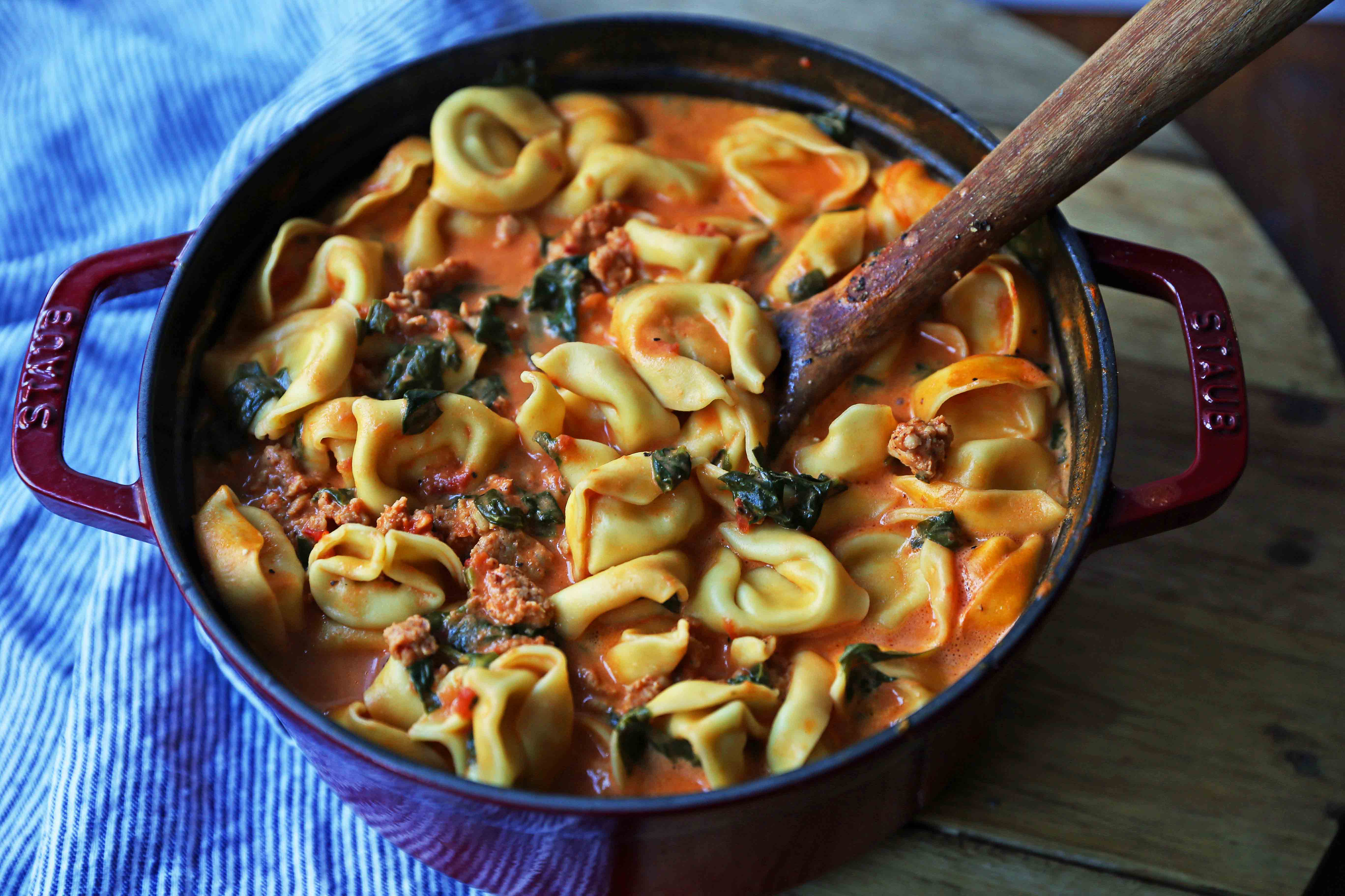 Creamy Sausage Tortellini Soup. A quick and easy 6-ingredient popular Creamy Sausage Tortellini Pasta Soup. A family favorite soup recipe! www.modernhoney.com #soup #souprecipe #sausagetortellinisoup #slowcooker #bestsoups