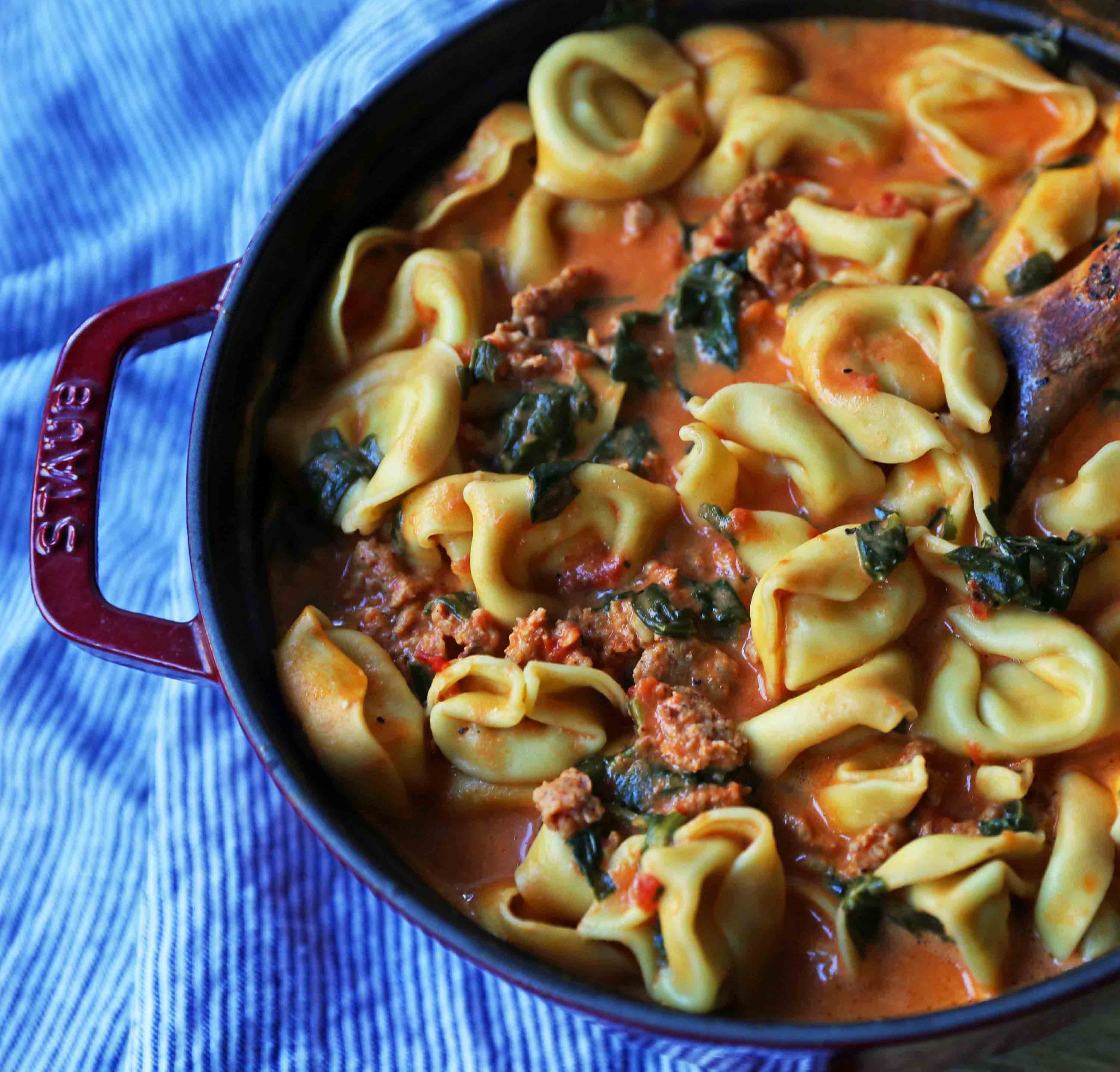 Creamy Sausage Tortellini Soup. A quick and easy 6-ingredient popular Creamy Sausage Tortellini Pasta Soup. A family favorite soup recipe! www.modernhoney.com #soup #souprecipe #sausagetortellinisoup #slowcooker #bestsoups