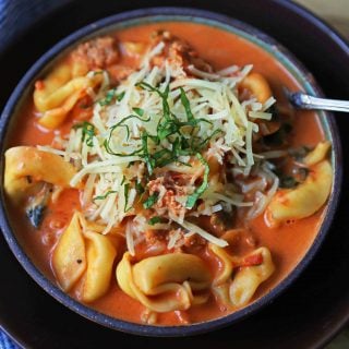 Creamy Sausage Tortellini Soup. A quick and easy 6-ingredient popular Creamy Sausage Tortellini Pasta Soup. A family favorite soup recipe! www.modernhoney.com #soup #souprecipe #sausagetortellinisoup #slowcooker #bestsoups