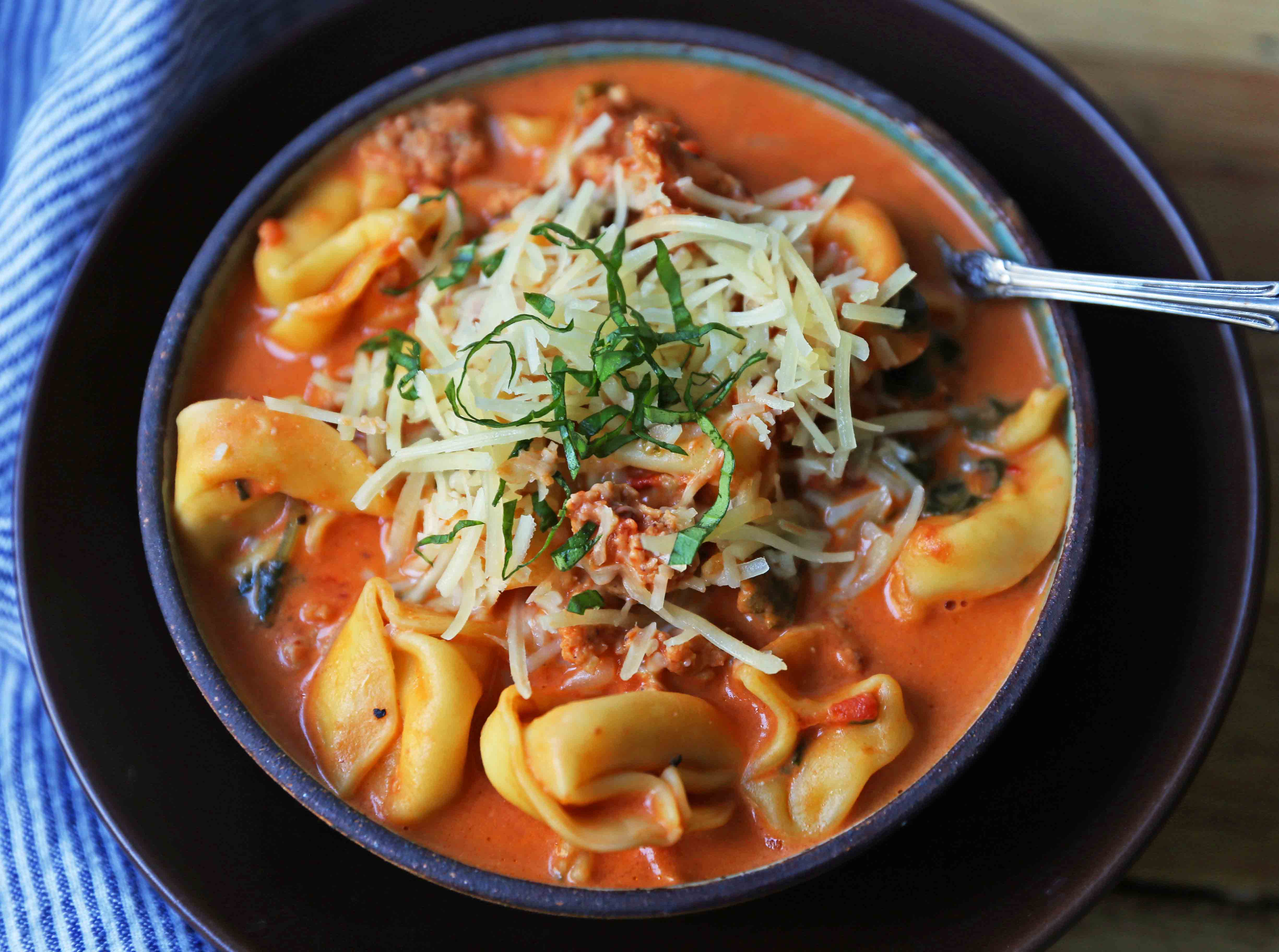 Creamy Sausage Tortellini Soup. A quick and easy 6-ingredient popular Creamy Sausage Tortellini Pasta Soup. A family favorite soup recipe! www.modernhoney.com #soup #souprecipe #sausagetortellinisoup #slowcooker #bestsoups