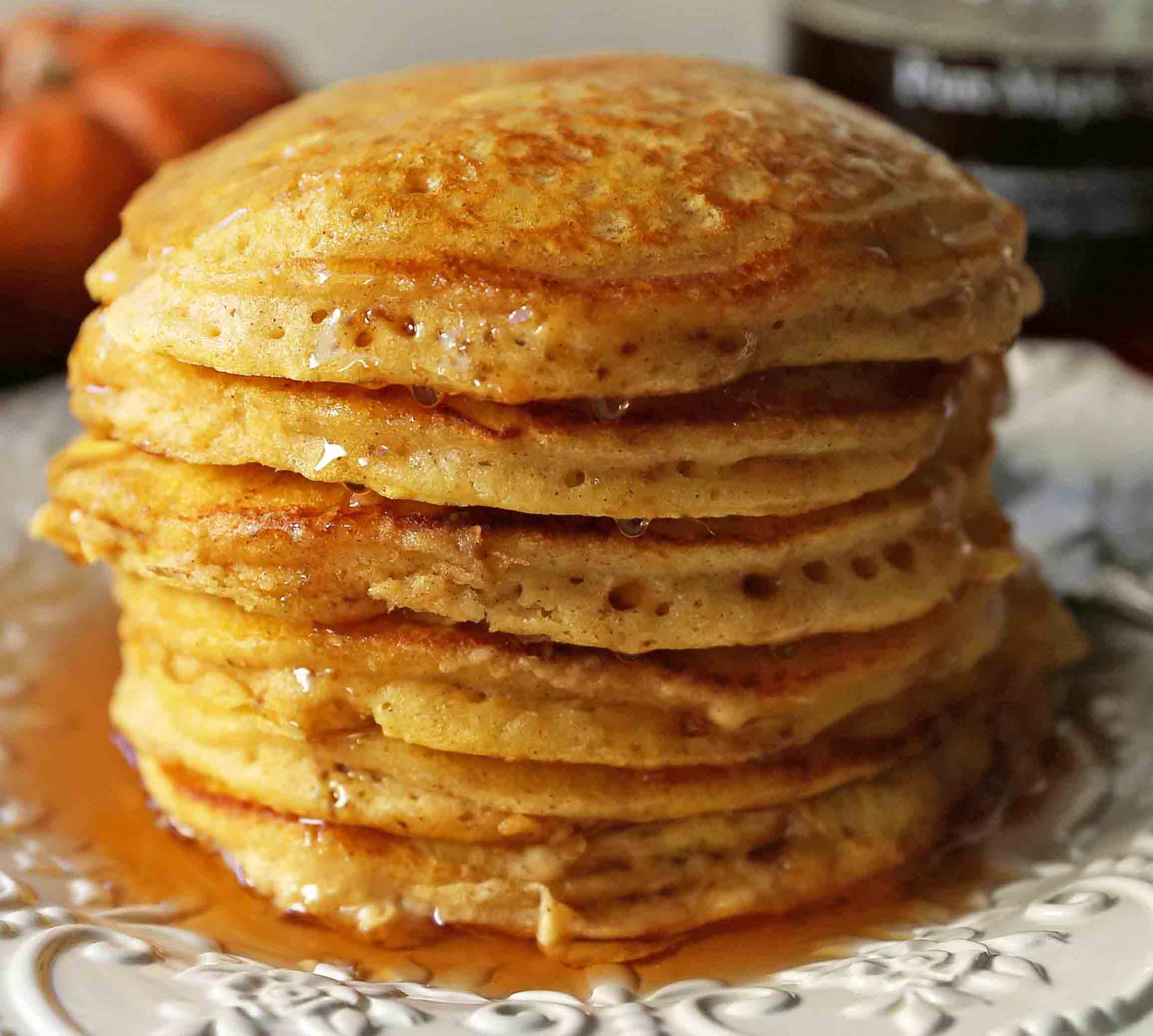 The BEST Pumpkin Pancakes. Light, fluffy, airy, and creamy pumpkin spiced pancakes. The perfect Fall breakfast. www.modernhoney.com #pumpkin #pumpkinpancakes #pumpkinrecipes #pumpkinbreakfast #fallbreakfast #pumpkinspice