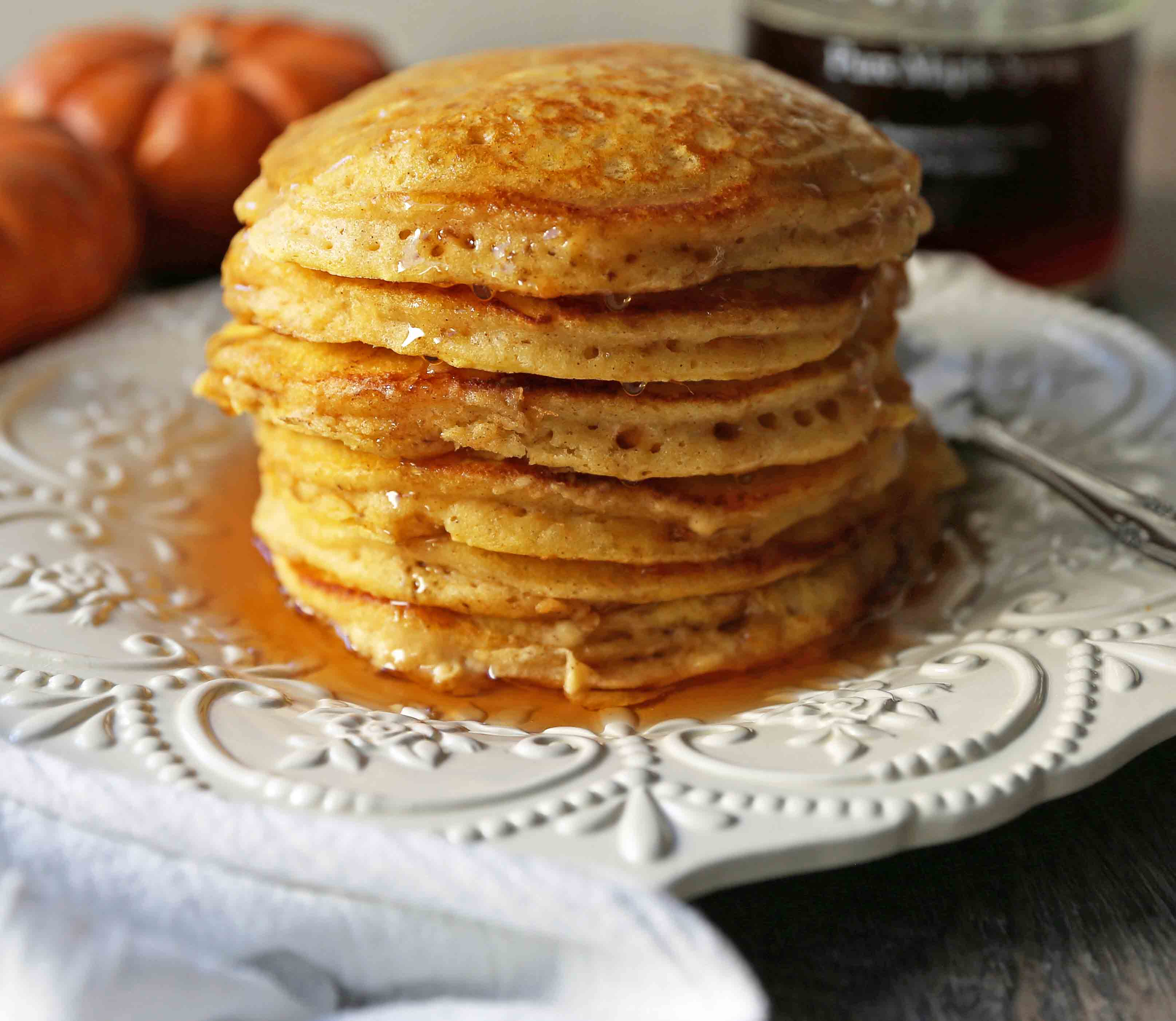 The BEST Pumpkin Pancakes. Light, fluffy, airy, and creamy pumpkin spiced pancakes. The perfect Fall breakfast. www.modernhoney.com #pumpkin #pumpkinpancakes #pumpkinrecipes #pumpkinbreakfast #fallbreakfast #pumpkinspice
