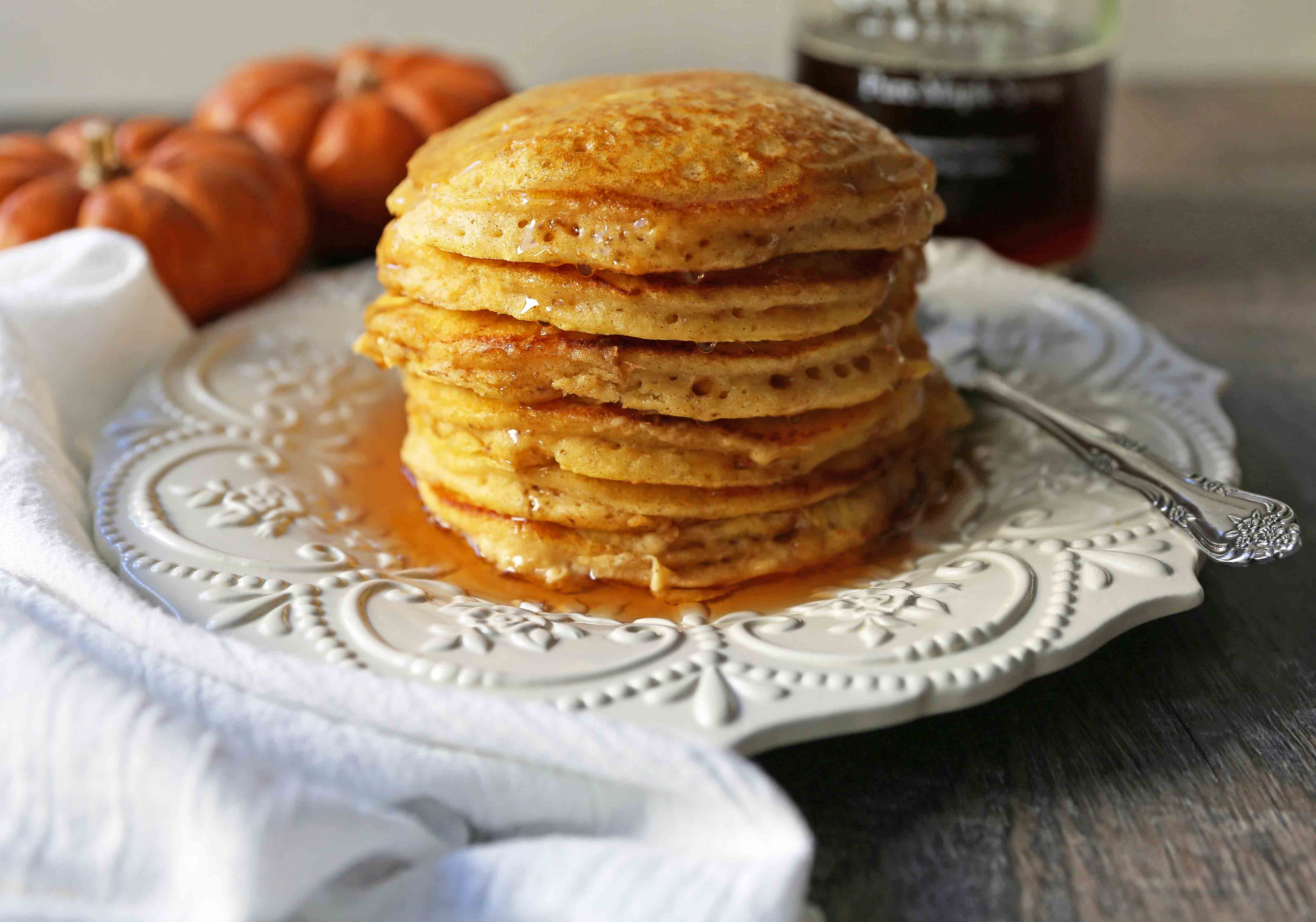 The BEST Pumpkin Pancakes. Light, fluffy, airy, and creamy pumpkin spiced pancakes. The perfect Fall breakfast. www.modernhoney.com #pumpkin #pumpkinpancakes #pumpkinrecipes #pumpkinbreakfast #fallbreakfast #pumpkinspice