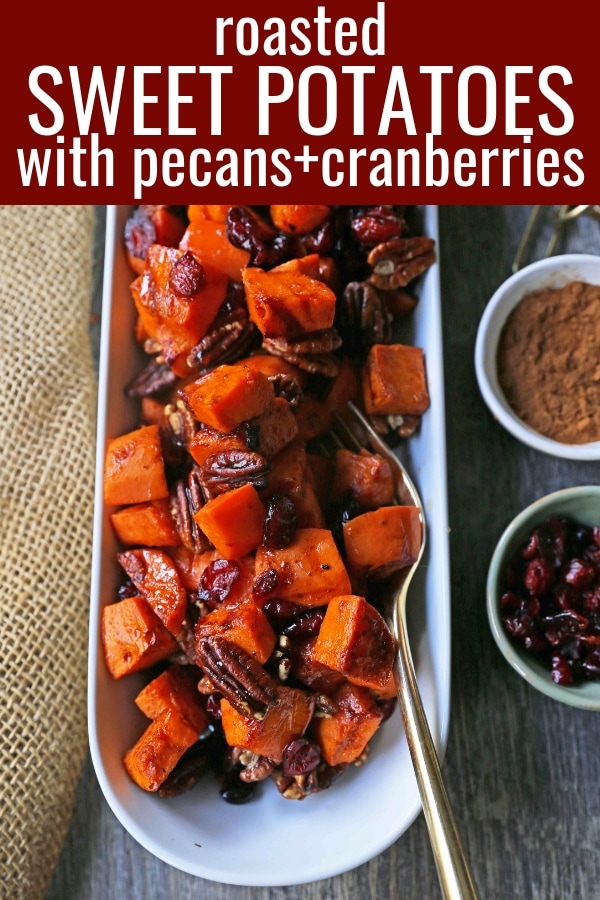 Roasted Sweet Potatoes with Pecans and Cranberries An easy, healthy side dish made with cinnamon roasted sweet potatoes, toasted pecans, and sweet and tart dried cranberries. www.modernhoney.com #sidedish #sweetpotatoes #sweetpotatoespecan #roastedsweetpotatoes