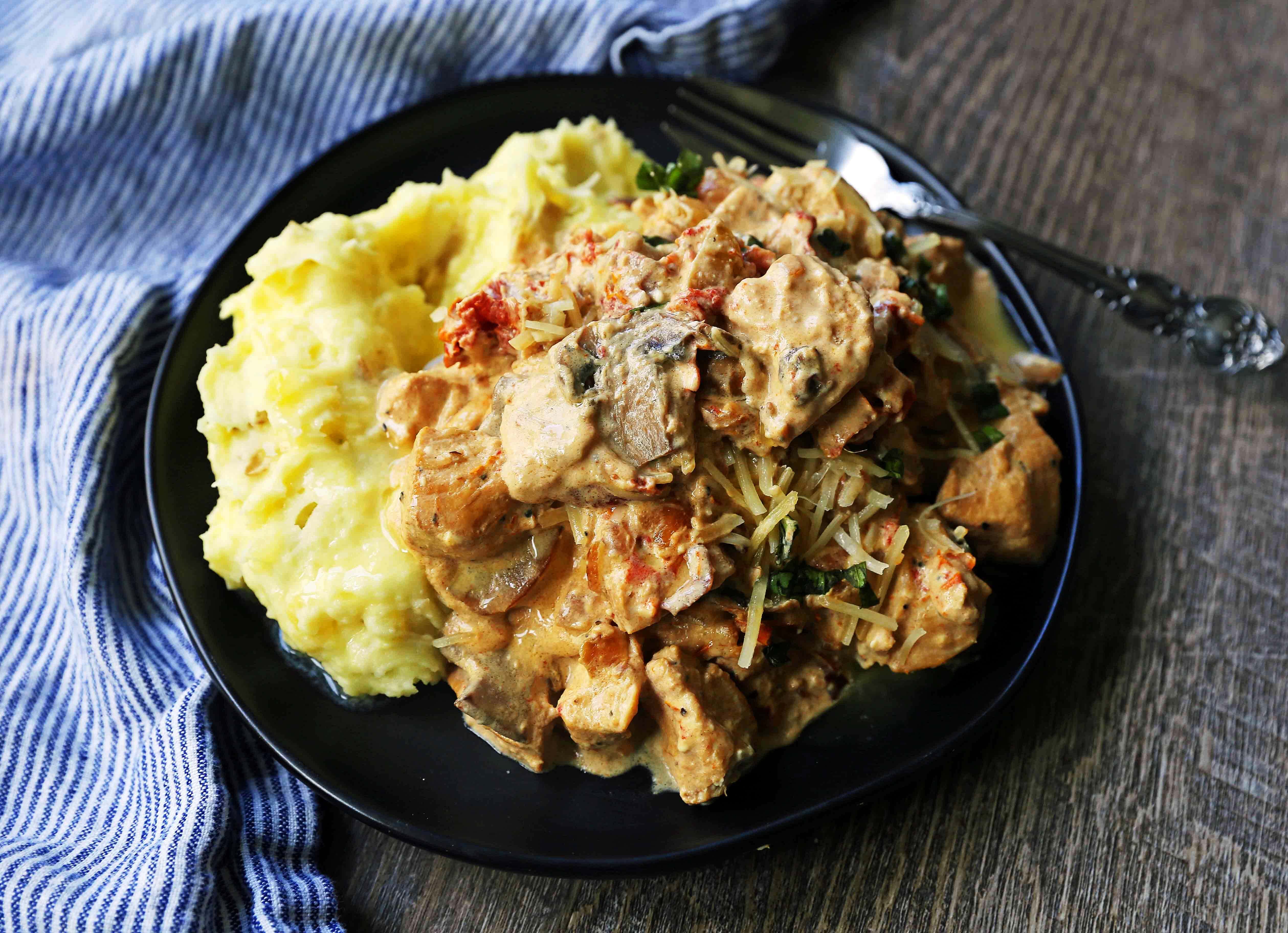 Slow Cooker Creamy Tuscan Chicken. Creamy tender chicken in prosciutto, mushroom, and sundried tomato cream sauce. Comfort food made in a slow cooker. www.modernhoney.com #dinner #slowcooker #slowcookerchicken #chickendinnerrecipes #creamychicken