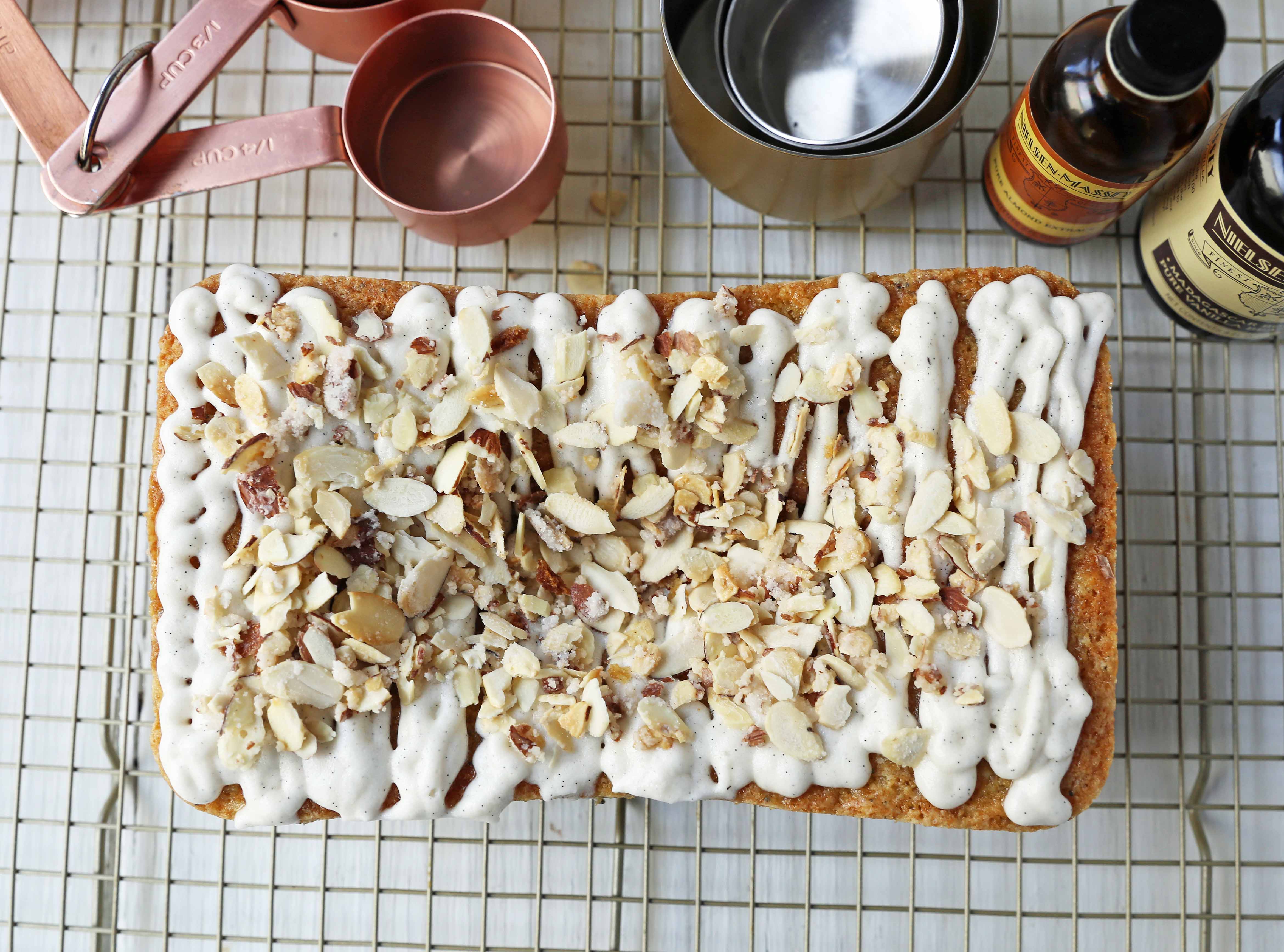 Almond Poppyseed Bread. Soft and moist poppyseed bread with vanilla bean almond glaze and candied almonds. The perfect poppyseed bread recipe. www.modernhoney.com #poppyseedbread #almondbread #quickbread 