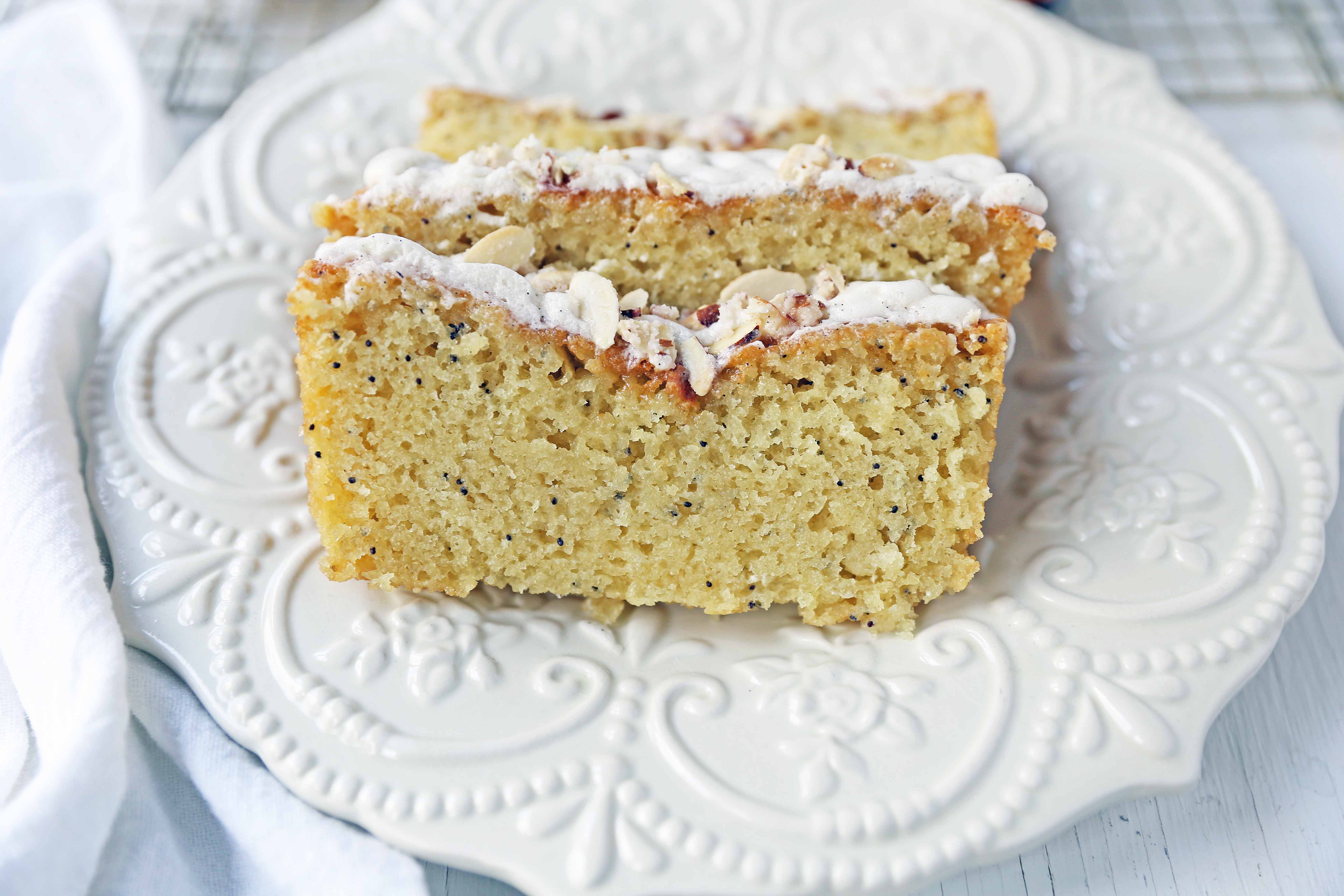 Almond Poppyseed Bread. Soft and moist poppyseed bread with vanilla bean almond glaze and candied almonds. The perfect poppyseed bread recipe. www.modernhoney.com #poppyseedbread #almondbread #quickbread 