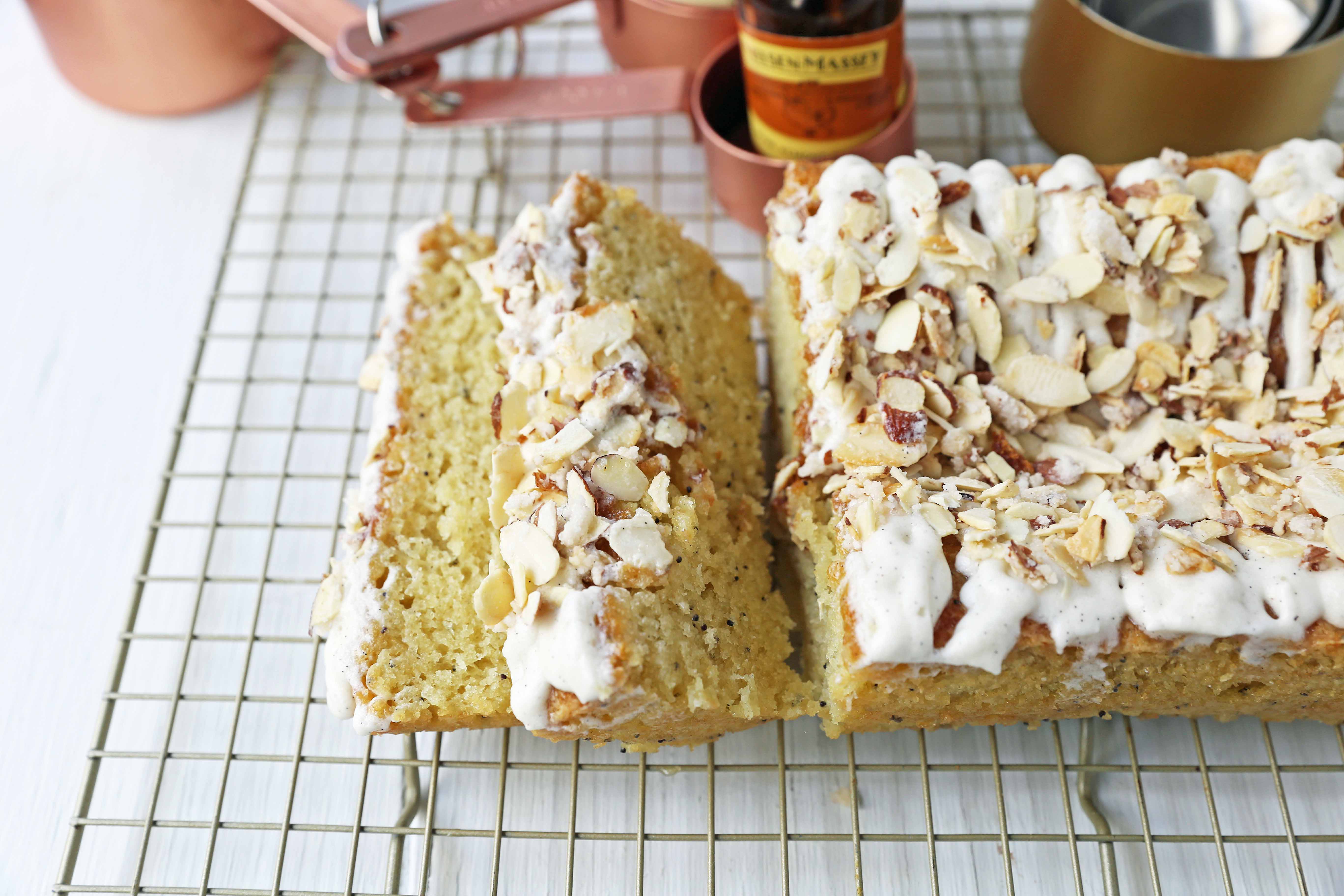 Almond Poppyseed Bread. Soft and moist poppyseed bread with vanilla bean almond glaze and candied almonds. The perfect poppyseed bread recipe. www.modernhoney.com #poppyseedbread #almondbread #quickbread 