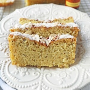 Almond Poppyseed Bread. Soft and moist poppyseed bread with vanilla bean almond glaze and candied almonds. The perfect poppyseed bread recipe.
