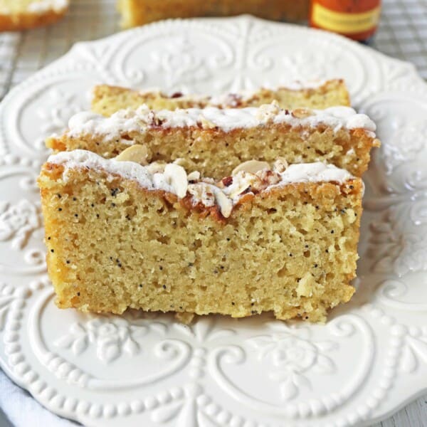 Almond Poppyseed Bread. Soft and moist poppyseed bread with vanilla bean almond glaze and candied almonds. The perfect poppyseed bread recipe.