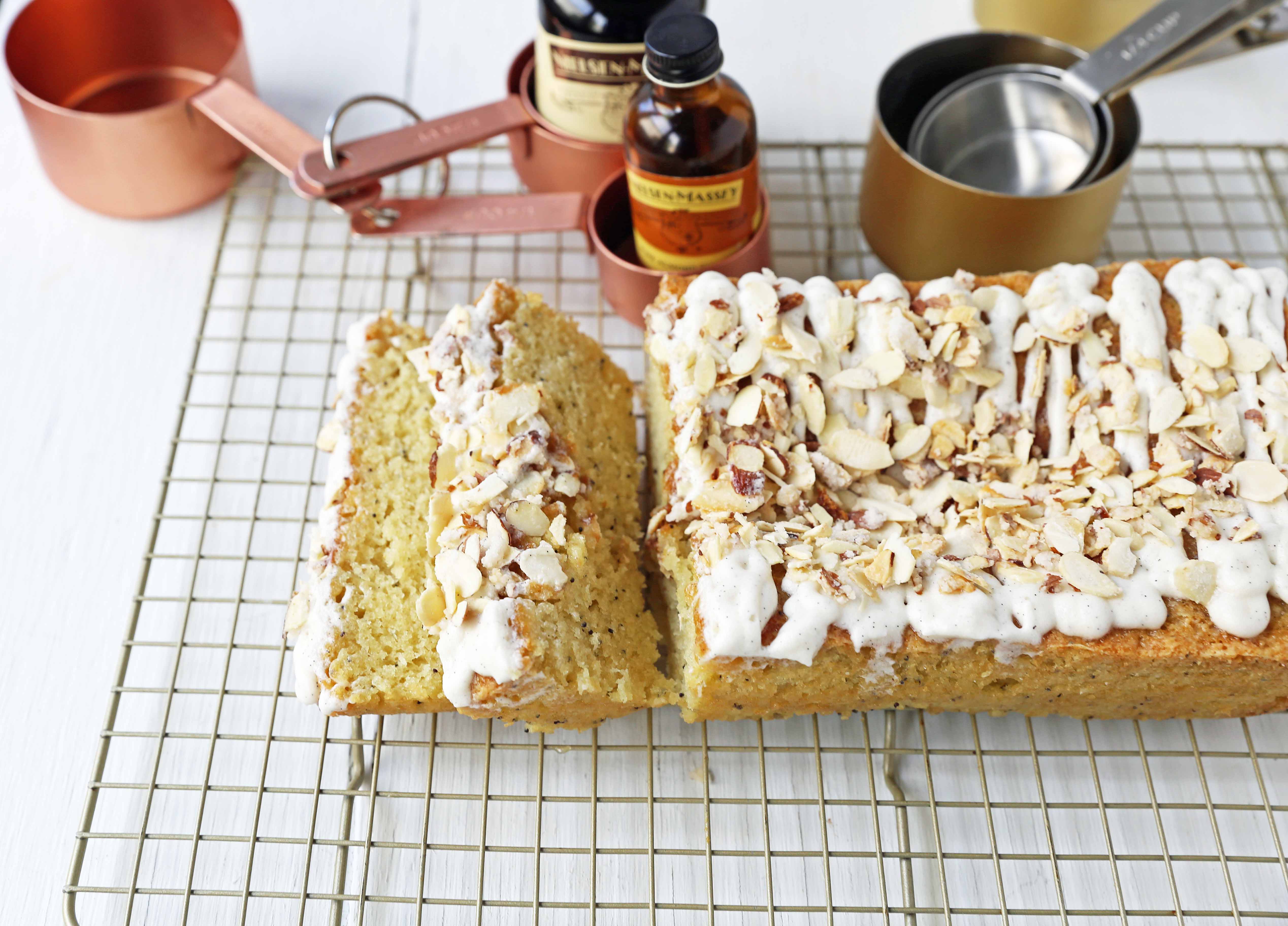 Almond Poppyseed Bread. Soft and moist poppyseed bread with vanilla bean almond glaze and candied almonds. The perfect poppyseed bread recipe. www.modernhoney.com #poppyseedbread #almondbread #quickbread 