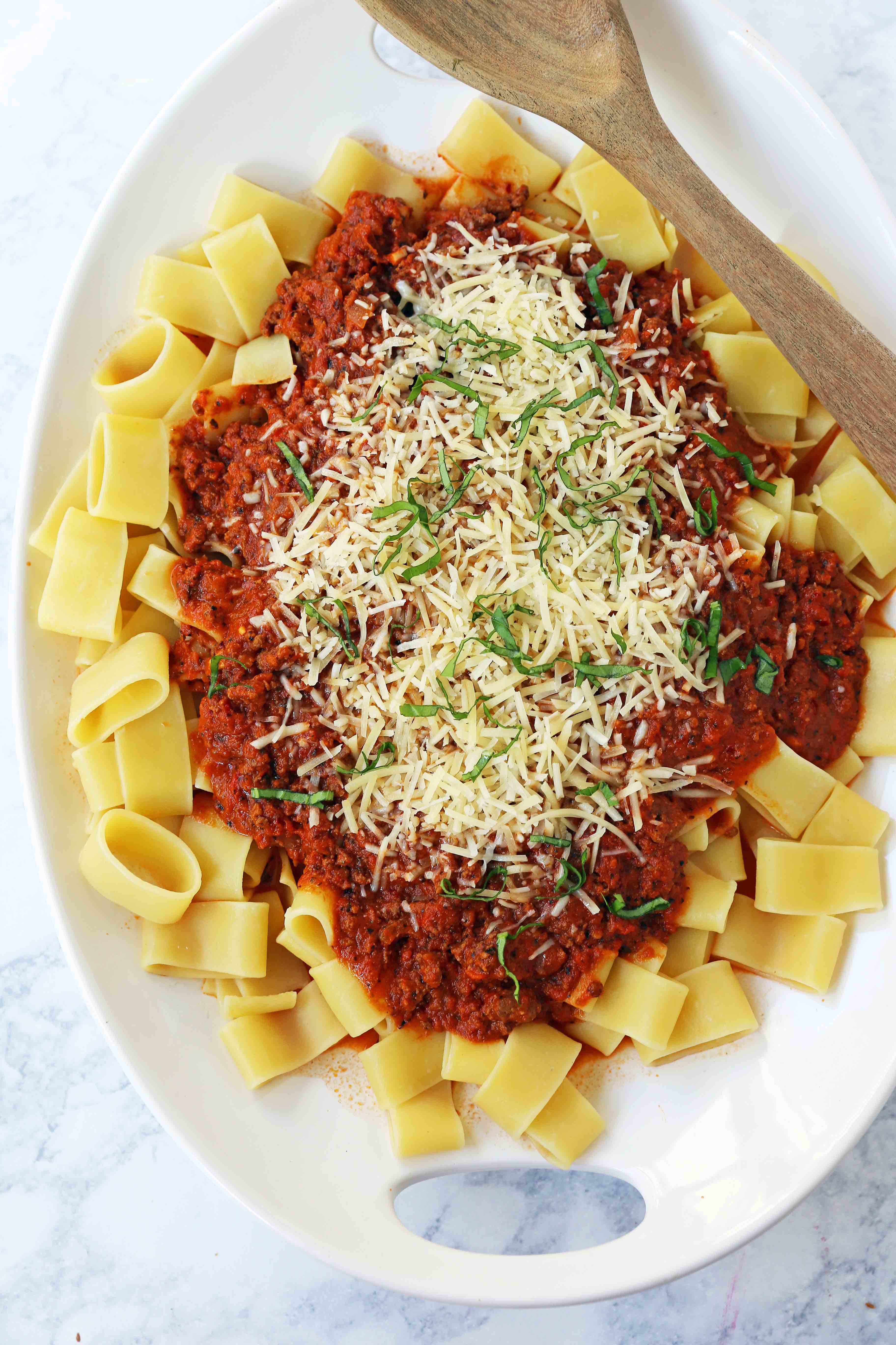 Beef Bolognese Sauce. Authentic Italian Beef Bolognese Sauce on top of fresh pasta is a warm, weeknight dish made in less than 30 minutes. www.modernhoney.com #italian #beefbolognese #pasta #spaghetti #italianfood