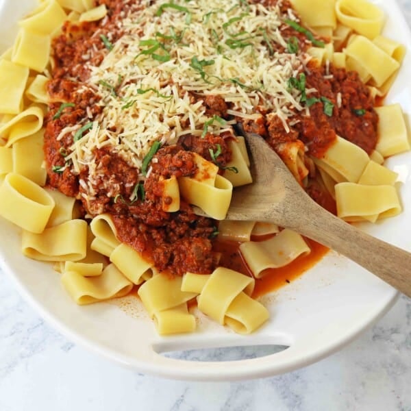 Beef Bolognese Sauce. Authentic Italian Beef Bolognese Sauce on top of fresh pasta is a warm, weeknight dish made in less than 30 minutes. www.modernhoney.com #italian #beefbolognese #pasta #spaghetti #italianfood