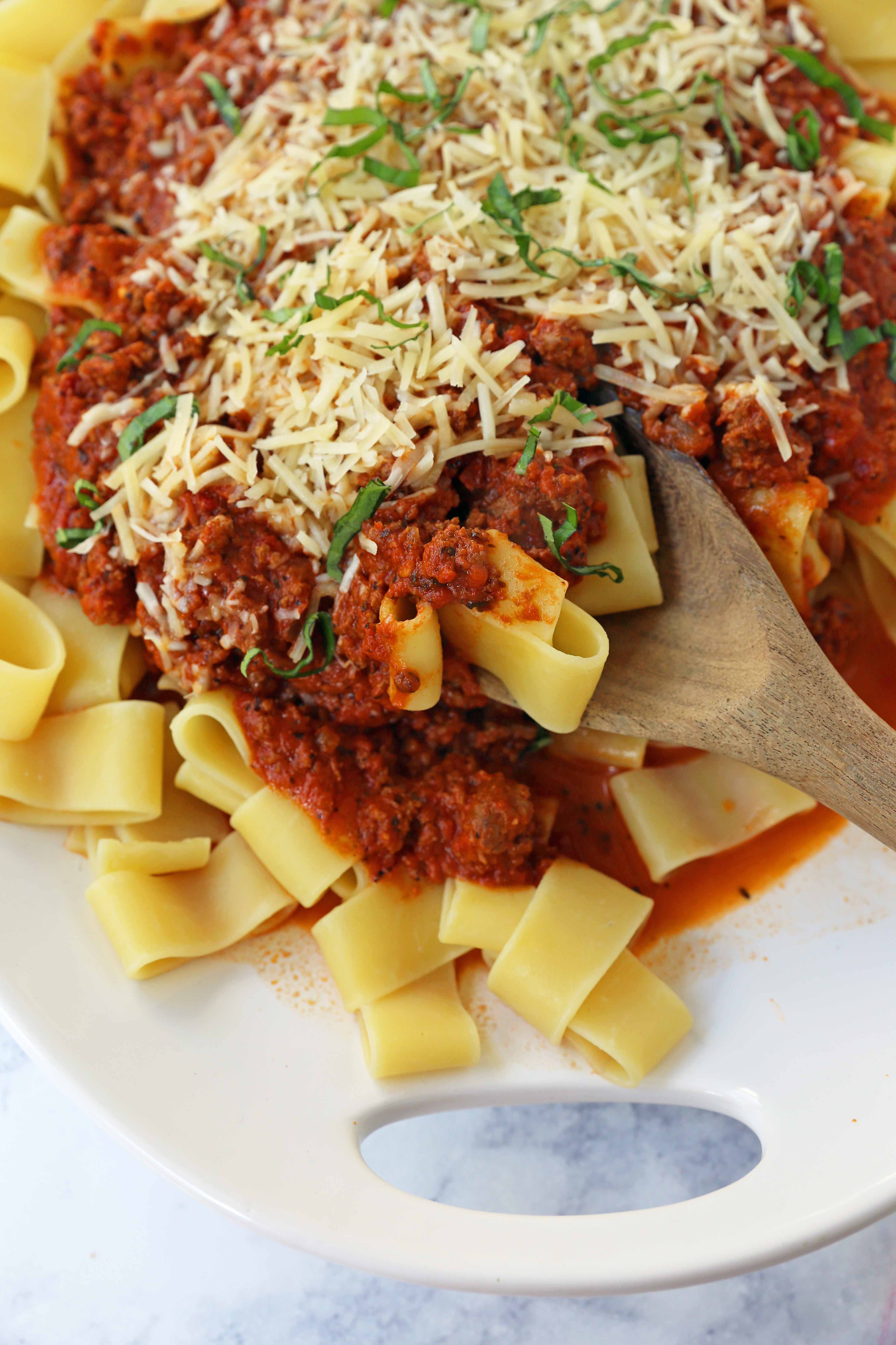 Beef Bolognese Sauce. Authentic Italian Beef Bolognese Sauce on top of fresh pasta is a warm, weeknight dish made in less than 30 minutes. www.modernhoney.com #italian #beefbolognese #pasta #spaghetti #italianfood