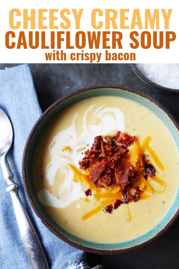 Cheesy Cauliflower Soup. A creamy cheesy cauliflower soup made with fresh cauliflower, cream, sharp cheddar cheese, and bacon. A velvety smooth cream of cauliflower soup will become a winter staple in your home! www.modernhoney.com #cauliflowersoup #cheesycauliflowersoup #creamofcauliflowersoup #soup #souprecipes