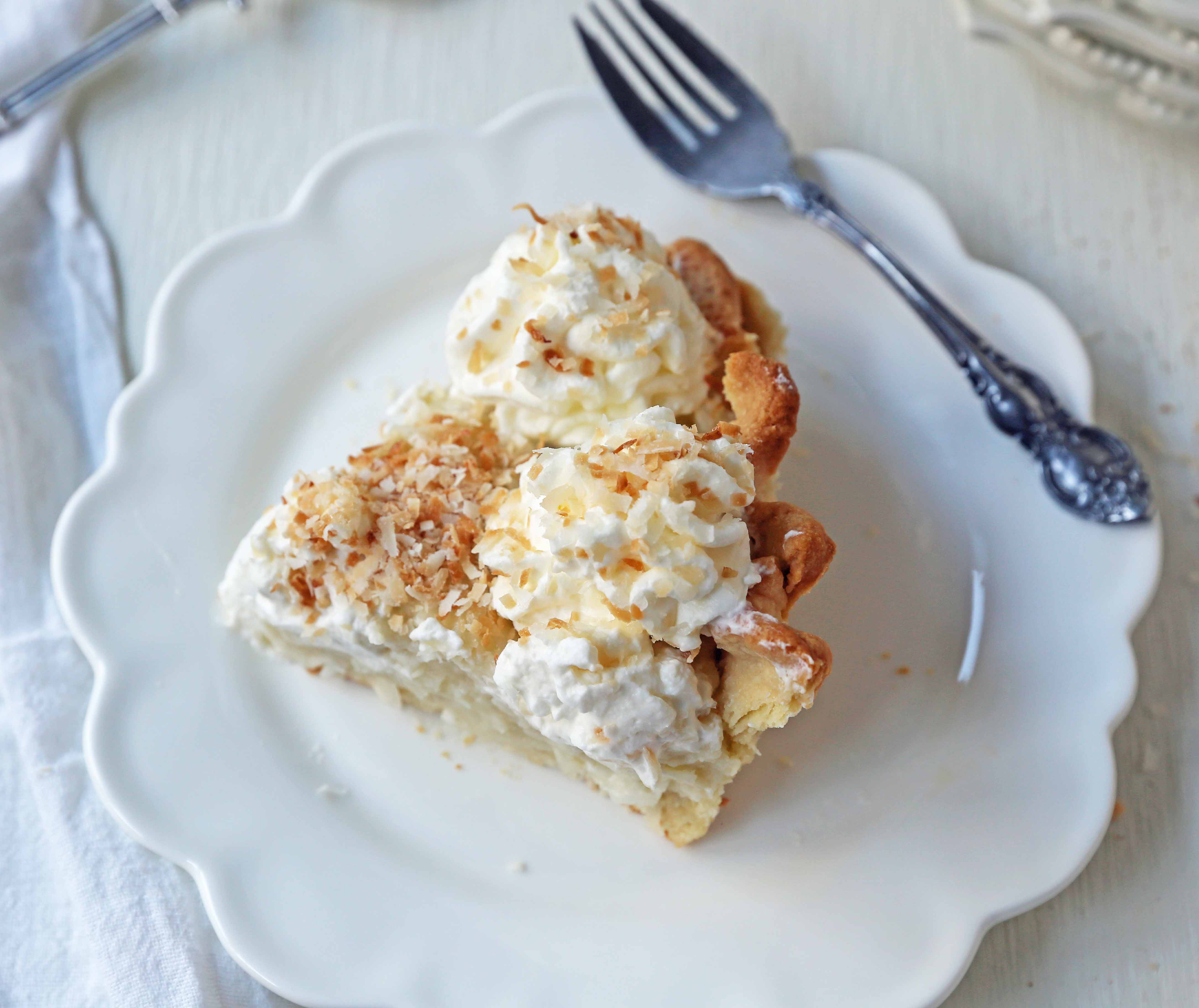 Coconut Cream Pie. A homemade coconut custard filling in a buttery pie crust topped with fresh whipped cream and toasted coconut. www.modernhoney.com #coconutcreampie #coconutpie #pie 