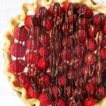 Raspberry Almond Cream Cheese Pie. A simple cream cheese almond pie with fresh raspberries and chocolate drizzle. An award-winning easy pie recipe! www.modernhoney.com #creamcheesepie #raspberrypie #pie #pierecipe #driscolls