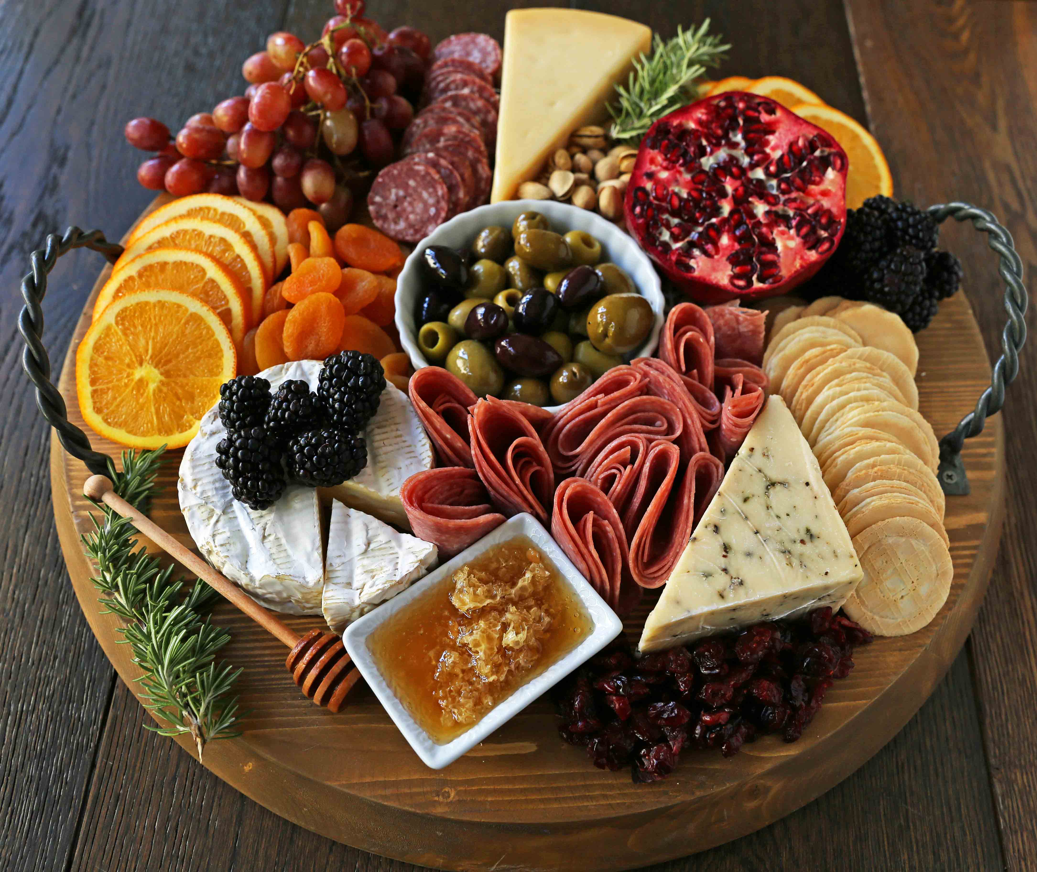 How to make an EPIC Charcuterie Board (AKA Meat and Cheese Platter). How to make a beautiful meat cheese and fruit platter. The perfect appetizer for your next party! www.modernhoney.com #meatboard #meatandcheeseboard #appetizer #appetizers #charcuterieboard #charcuterie #cheeseboard