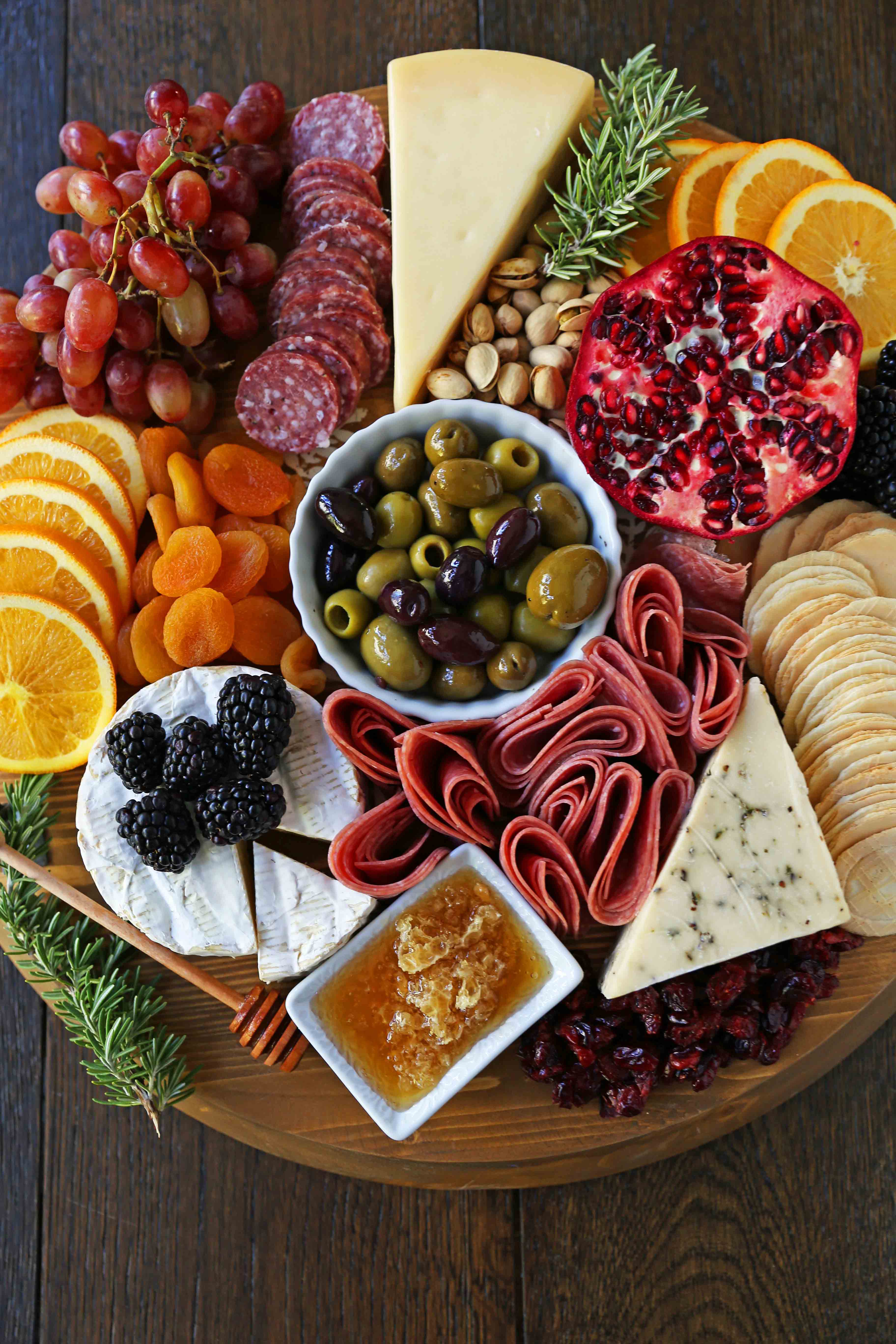How to make an EPIC Charcuterie Board (AKA Meat and Cheese Platter). How to make a beautiful meat cheese and fruit platter. The perfect appetizer for your next party! www.modernhoney.com #meatboard #meatandcheeseboard #appetizer #appetizers #charcuterieboard #charcuterie #cheeseboard