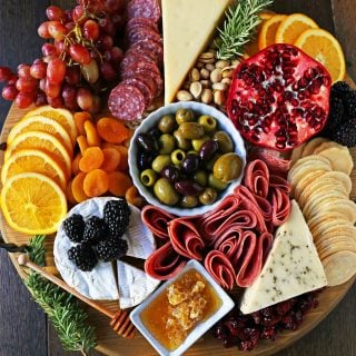 How to make an EPIC Charcuterie Board (AKA Meat and Cheese Platter). How to make a beautiful meat cheese and fruit platter. The perfect appetizer for your next party! www.modernhoney.com #meatboard #meatandcheeseboard #appetizer #appetizers #charcuterieboard #charcuterie #cheeseboard