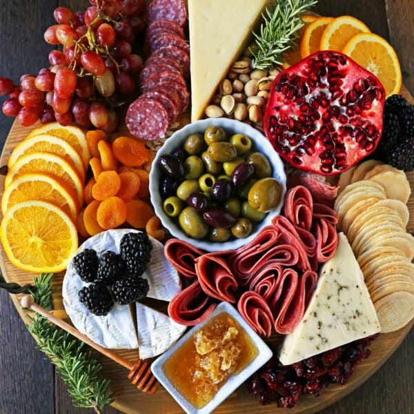 How to make an EPIC Charcuterie Board (AKA Meat and Cheese Platter). How to make a beautiful meat cheese and fruit platter. The perfect appetizer for your next party! www.modernhoney.com #meatboard #meatandcheeseboard #appetizer #appetizers #charcuterieboard #charcuterie #cheeseboard