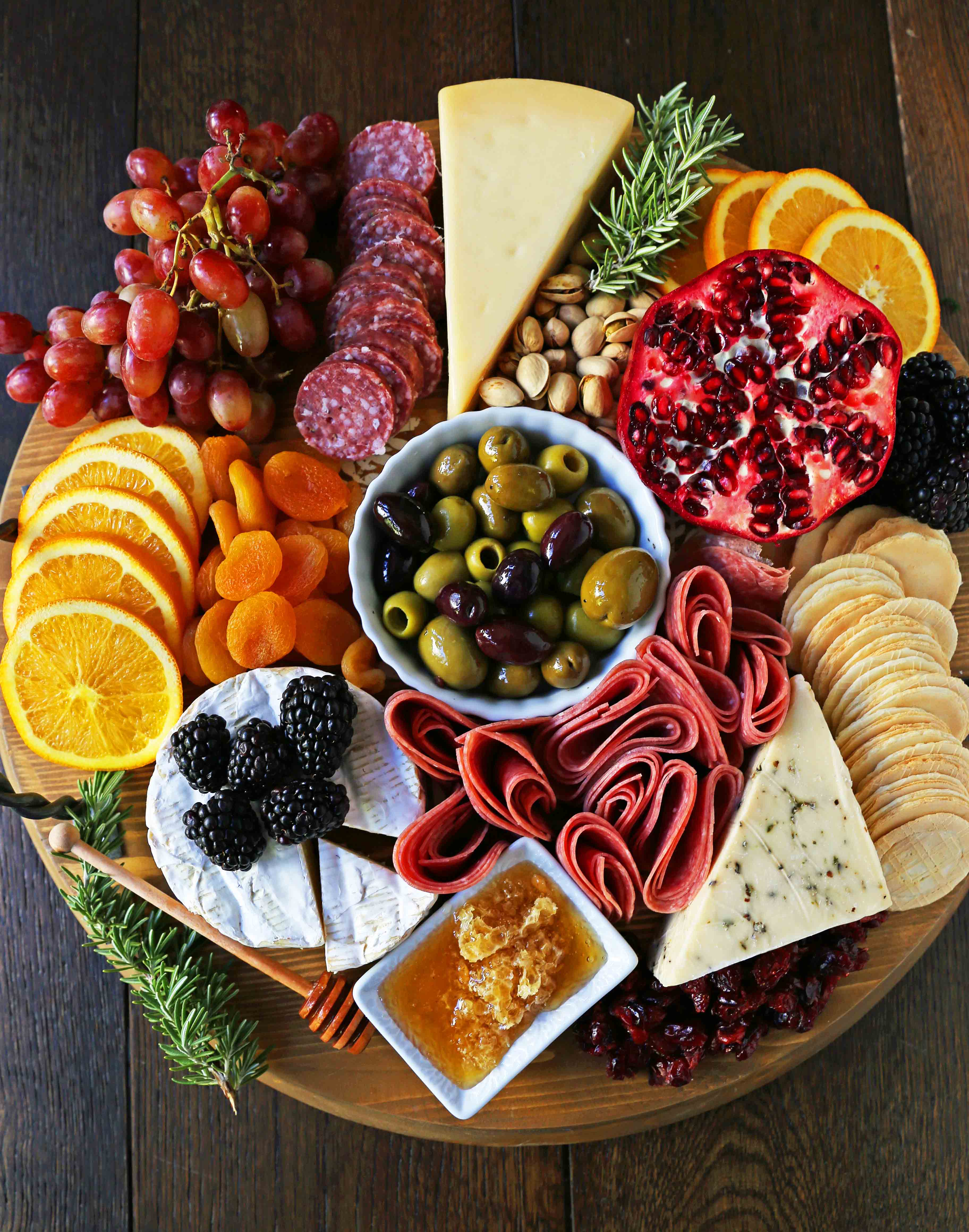 How to make an EPIC Charcuterie Board (AKA Meat and Cheese Platter). How to make a beautiful meat cheese and fruit platter. The perfect appetizer for your next party! www.modernhoney.com #meatboard #meatandcheeseboard #appetizer #appetizers #charcuterieboard #charcuterie #cheeseboard