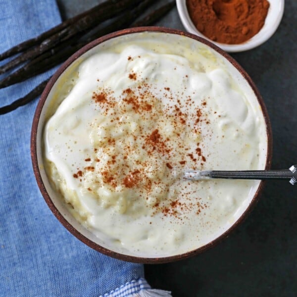 Creamy Homemade Rice Pudding. Rich and Creamy Rice Pudding with Creme Anglaise and Fresh Whipped Cream. www.modernhoney.com #ricepudding #ricepuddingrecipe #christmasrecipes #christmasrecipes