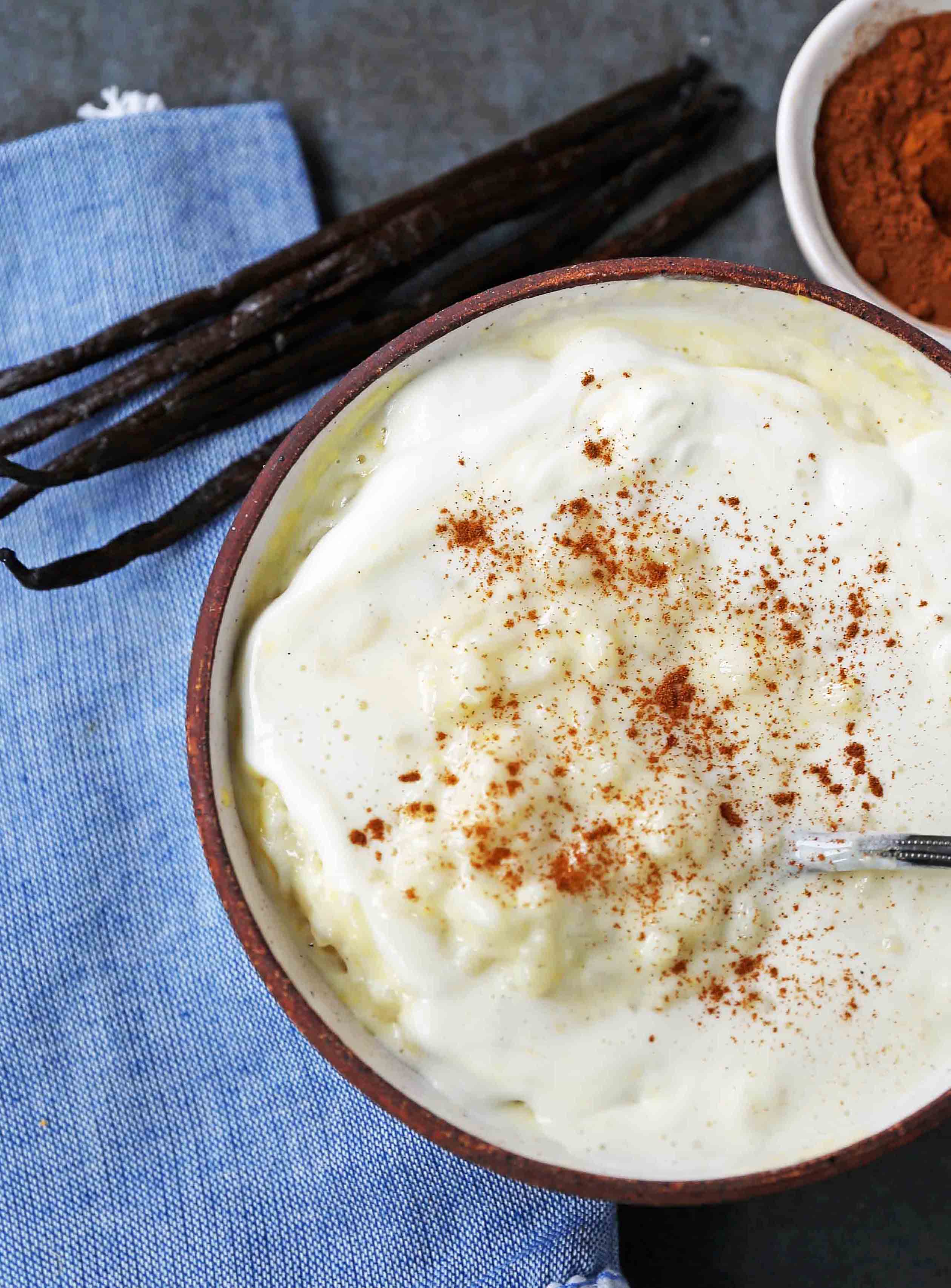 Creamy Homemade Rice Pudding. Rich and Creamy Rice Pudding with Creme Anglaise and Fresh Whipped Cream. www.modernhoney.com #ricepudding #ricepuddingrecipe #christmasrecipes #christmasrecipes