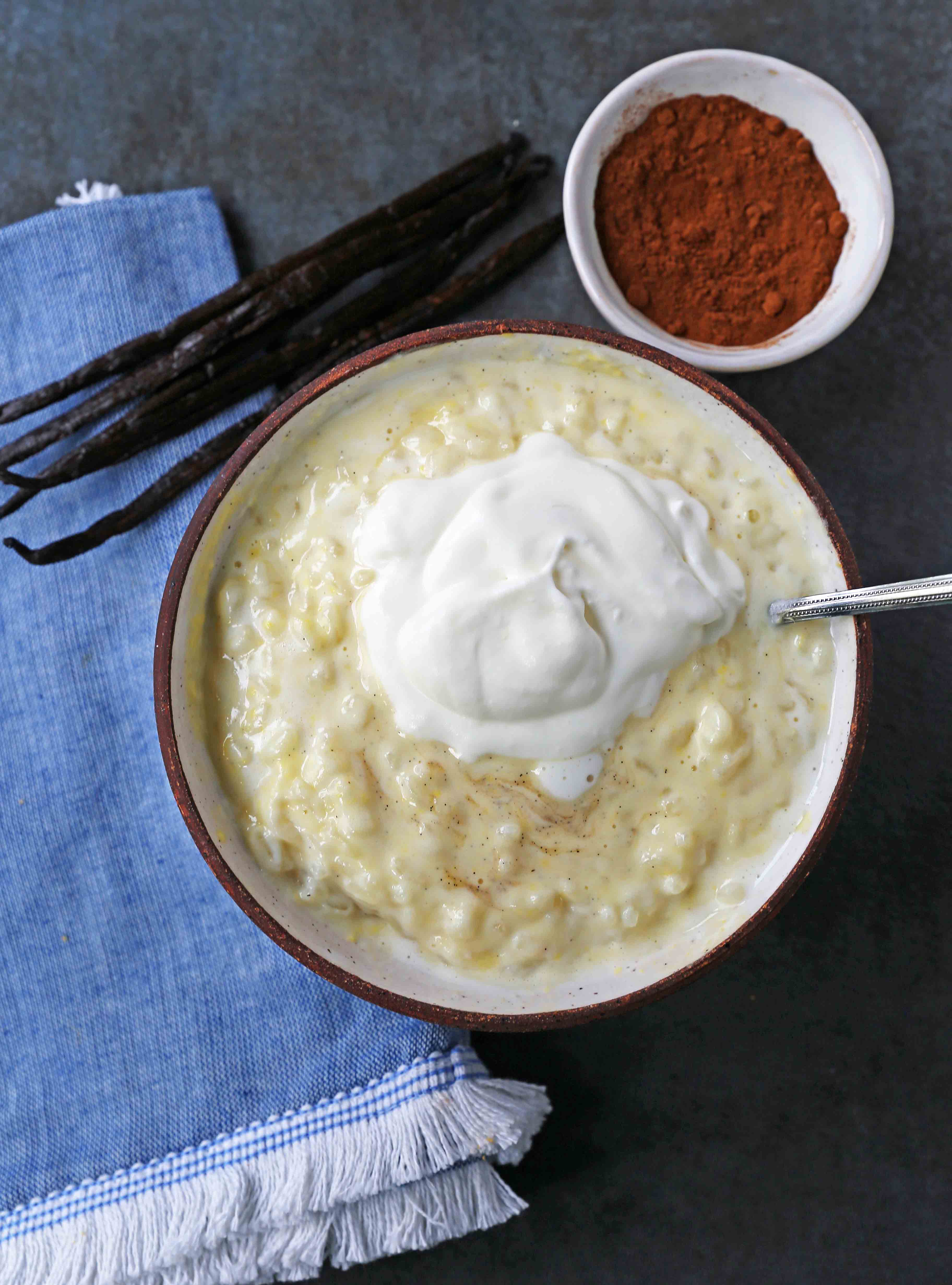 Creamy Homemade Rice Pudding. Rich and Creamy Rice Pudding with Creme Anglaise and Fresh Whipped Cream. www.modernhoney.com #ricepudding #ricepuddingrecipe #christmasrecipes #christmasrecipes