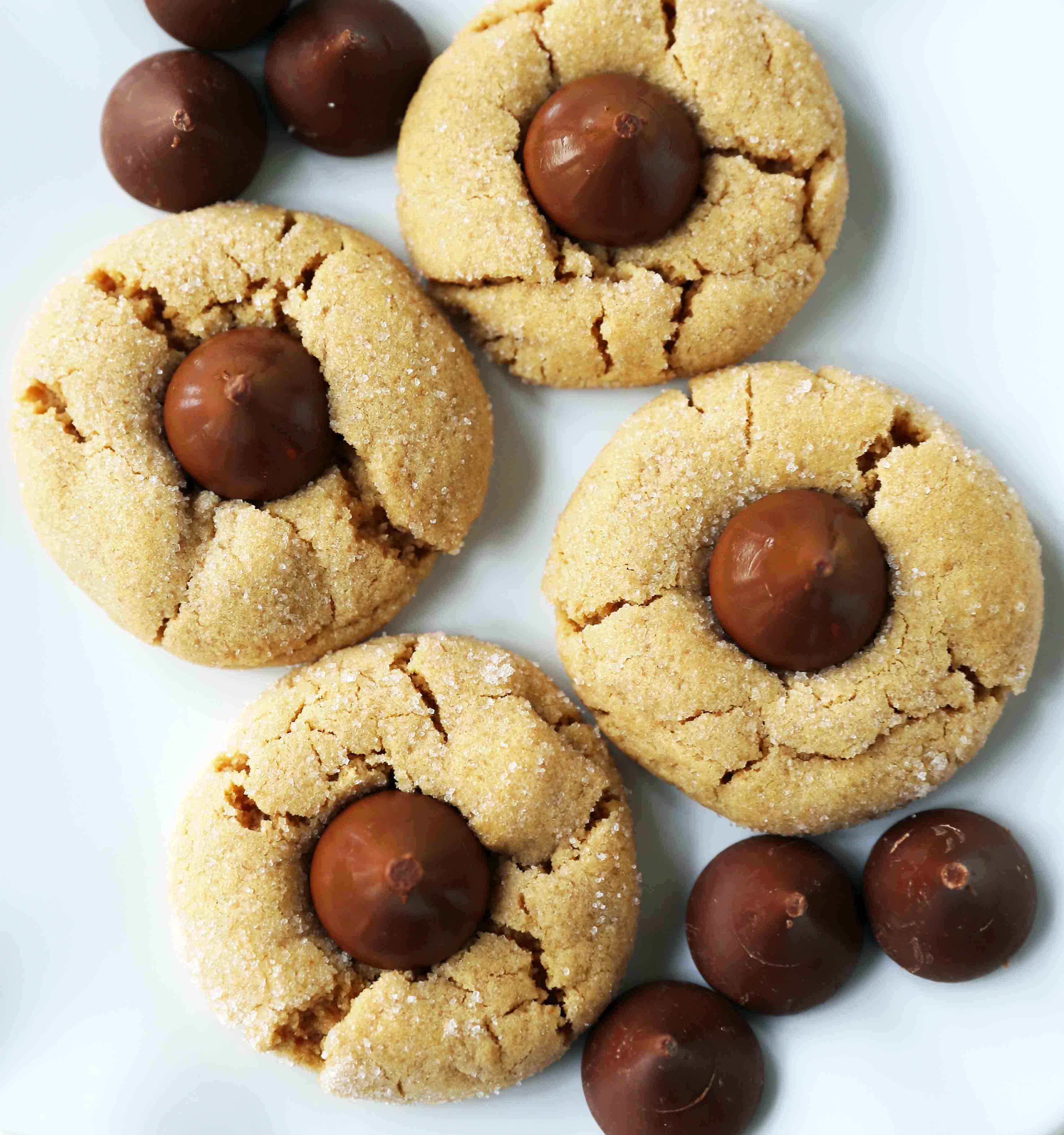Peanut Butter Blossoms Cookies. Peanut Butter Chocolate Kiss Cookies are such a popular cookie recipe. Everyone loves these Kiss Cookies! www.modernhoney.com #chocolatepeanutbuttercookies #kisscookies #chocolatekisscookies #peanutbuttercookies #christmascookies