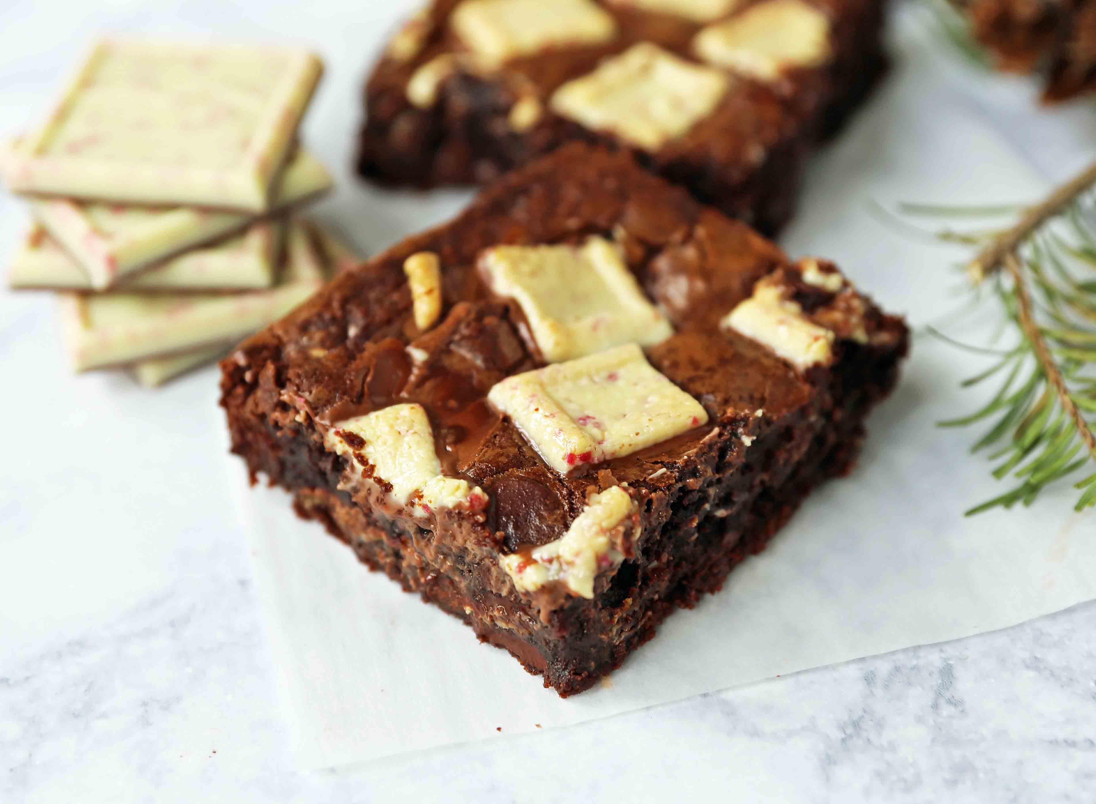 Peppermint Bark Chocolate Brownies. Decadent homemade chocolate brownies with white chocolate peppermint bark. The perfect Christmas holiday brownie. www.modernhoney.com #peppermintbarkbrownies #peppermintbrownies #christmasbrownies 