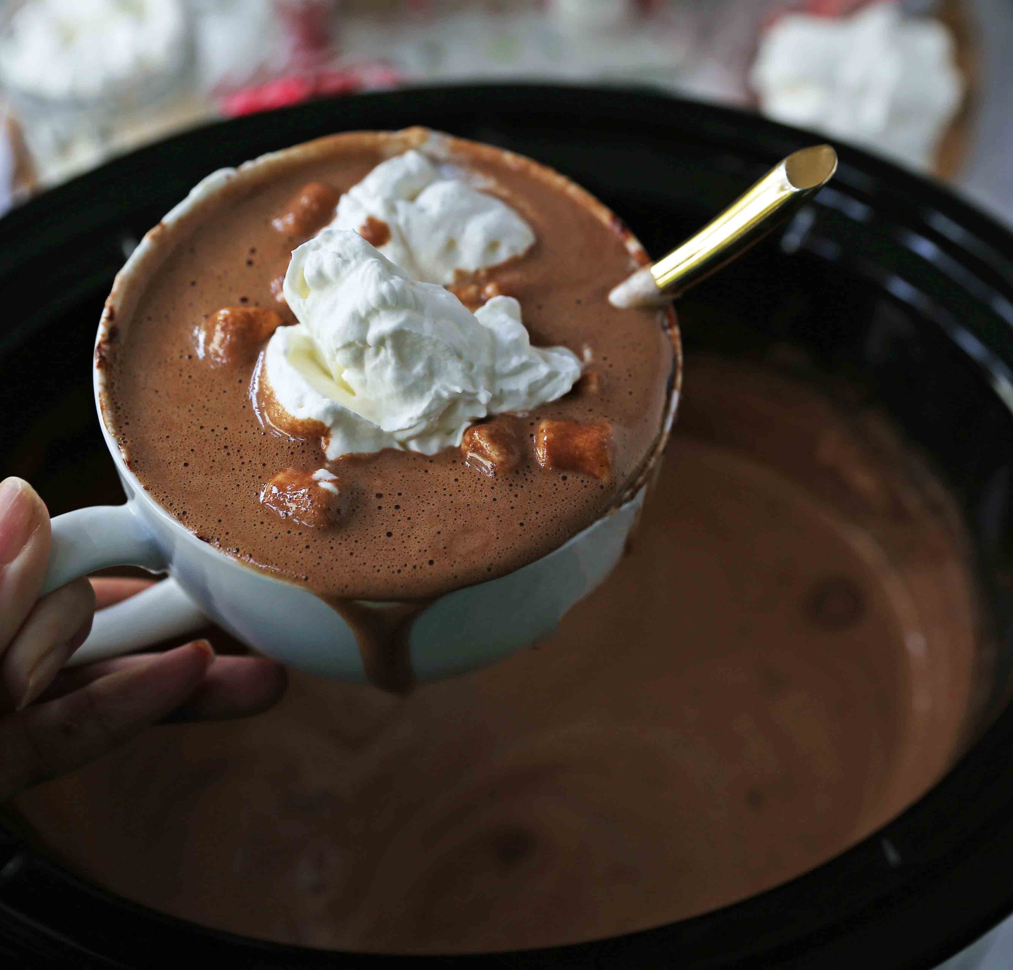 Homemade Hot Chocolate Recipe. How to make easy 5-ingredient gourmet hot chocolate. This Slow Cooker Hot Chocolate is perfect to serve at parties. A list of hot chocolate toppings ideas to make your very own Hot Chocolate Bar. www.modernhoney.com #hotchocolate #homemadehotchocolate #chocolate #hotchocolatebar #hotchocolatetoppings #christmas